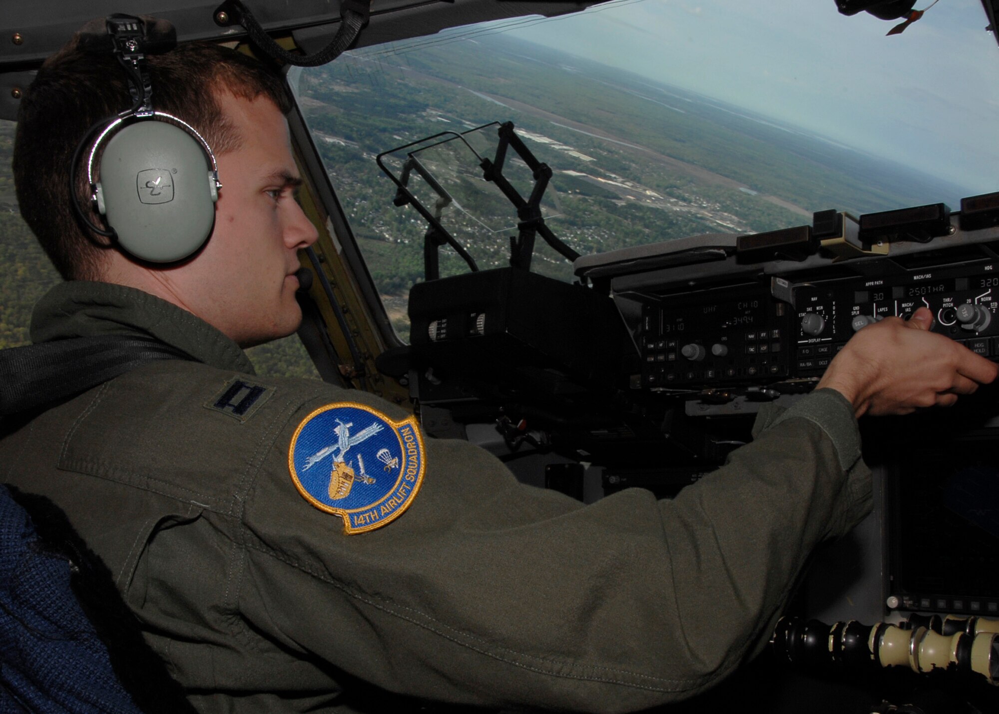Capt. Aaron Strode flies a C-17 during a training mission around the Charleston area Sunday. Captain Strode is a pilot for the 14th Airlift Squadron. (U.S. Air Force photo/Airman 1st Class Katie Gieratz)
