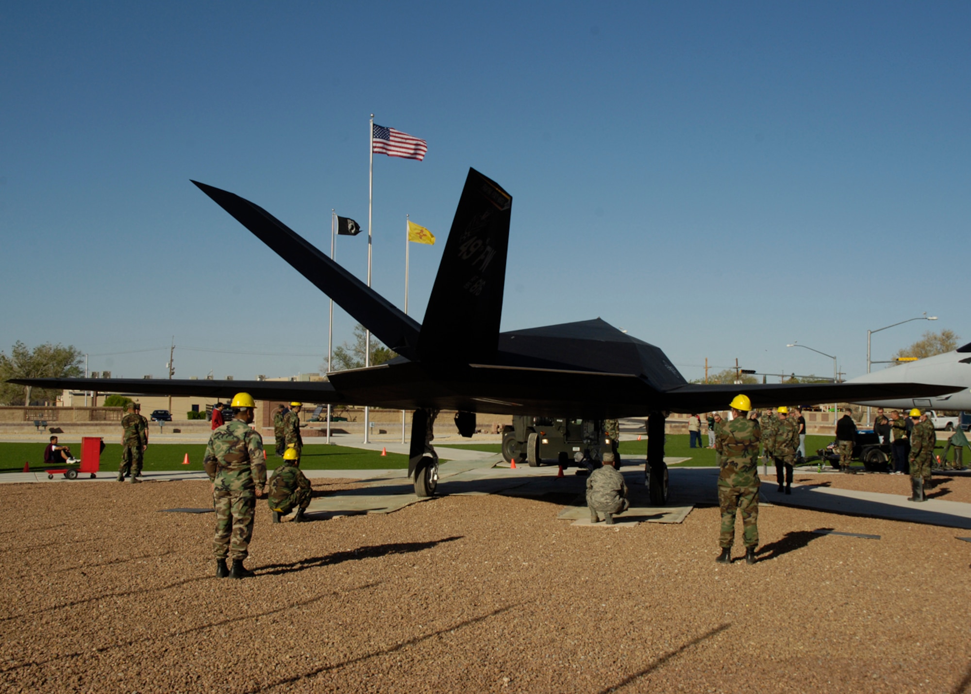 HOLLOMAN AIR FORCE BASE, N.M. -- Airmen from the 49th Maintenance Squadron escort an F-117A across base from it’s hangar to it’s new home; Heritage Park on Holloman Air Force Base, N.M., April 5.  (U.S. Air Force photo/Airman 1st Class Michael J. Means)