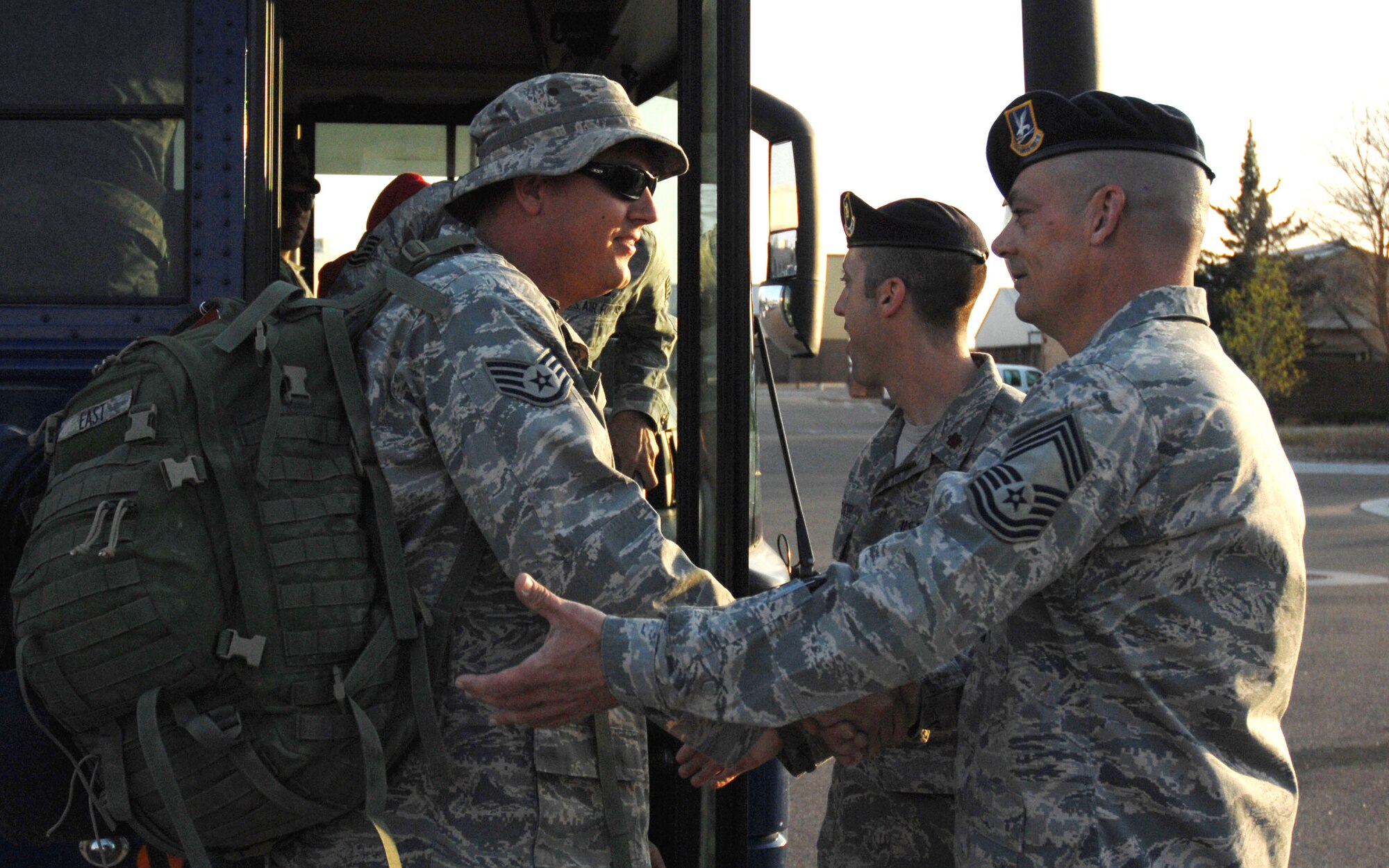 CANNON AIR FORCE BASE, N.M.-- Staff Sgt. Charles East, 27th Special Operations Security Forces Squadron, receives a welcome home handshake from Chief Master Sgt. Jeffrey Howard, 27th SOSFS superintendent April 8.  Sergeant East returned to Cannon after a six-month deployment. (U.S. Air Force photo by Airman 1st Class Evelyn Chavez)