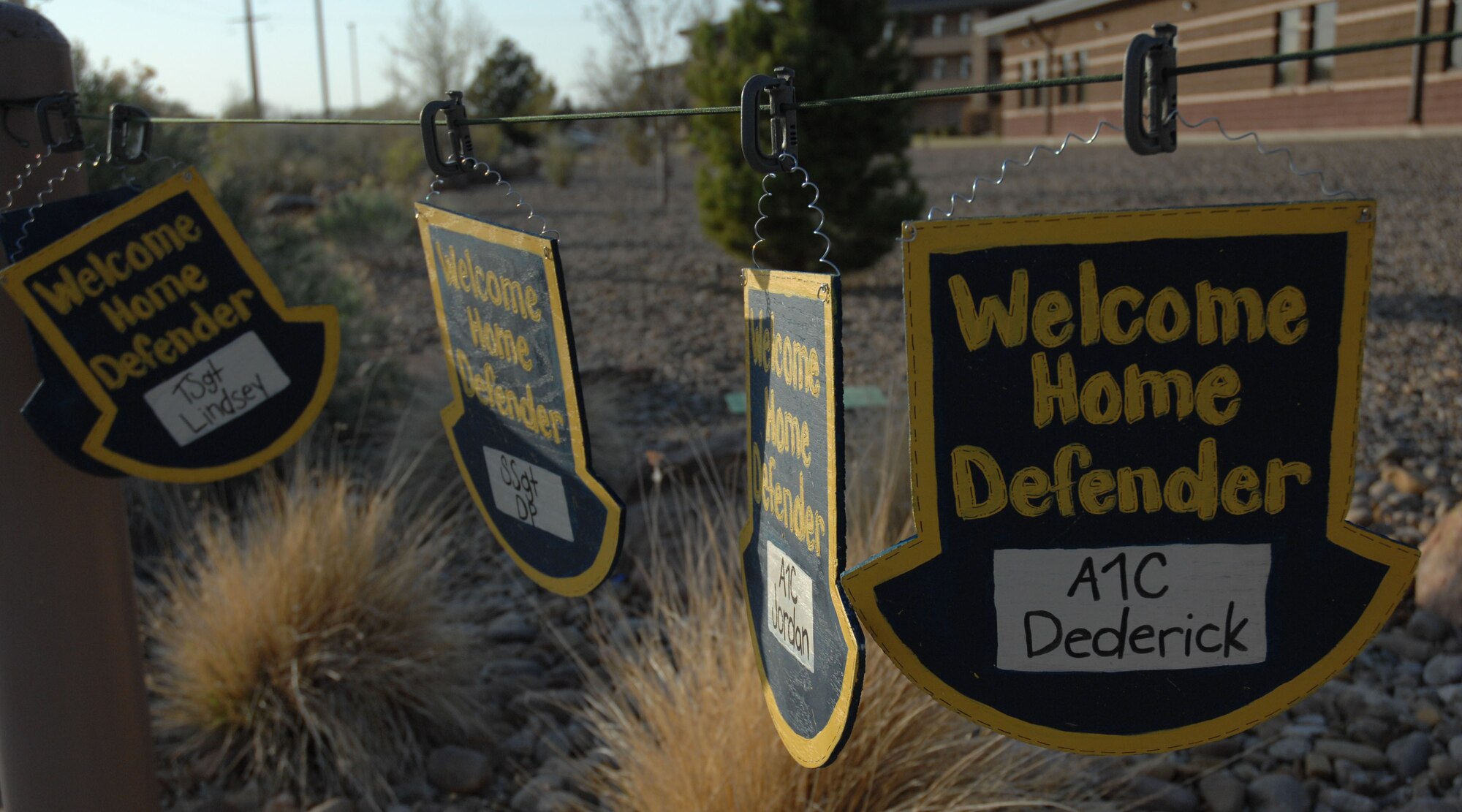 CANNON AIR FORCE BASE, N.M.-- Welcome home signs are displayed outside the 27th Special Operations Security Forces Squadron building April 8.  Airmen returned home after a six-month deployment. (U.S. Air Force photo by Airman 1st Class Evelyn Chavez)