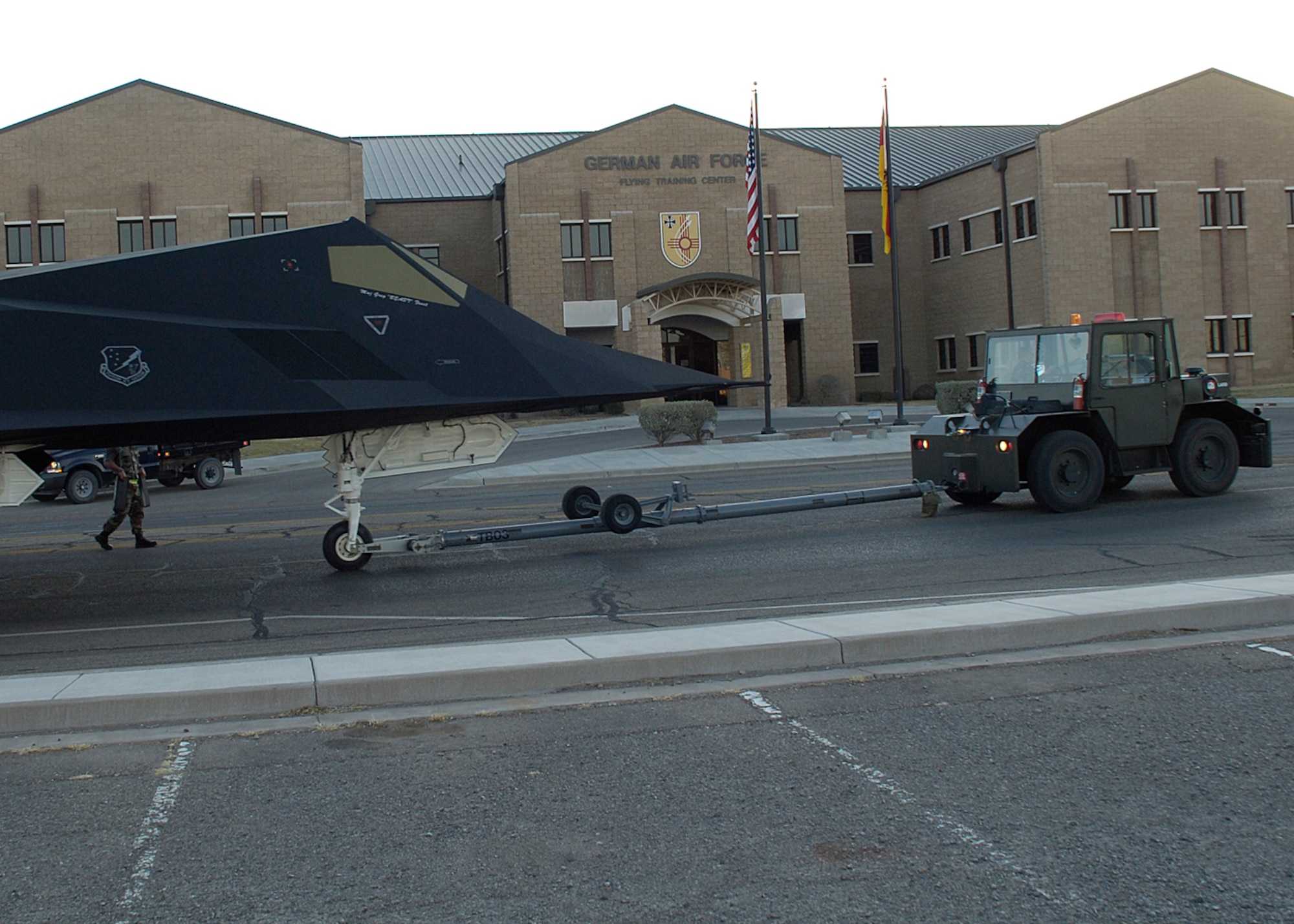 HOLLOMAN AIR FORCE BASE, N.M. -- Airmen from the 49th Maintenance Squadron escort an F-117A to its new home in Heritage Park here April 5. (U.S. Air Force photo/Airman 1st Class Michael J. Means)