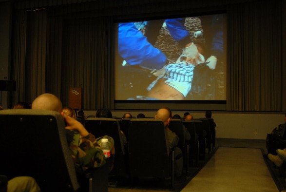 Airmen with the 412th Operations Group watch a video presentation about driving under the influence during the 412th OG's commander's call at base theater on April 4. (Air Force photo by Senior Airman Julius Delos Reyes)