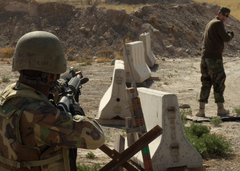 HOLLOMAN AIR FORCE BASE, N.M --Airman 1st Class Lakeif Ferron, 49th Civil Engineer Squadron, challenges a suspect played by Senior Airman Norman Luper , also from the 49 CES, during the phase two exercise here April 2. (U.S. Air Force photo/Airman 1st Class Michael J. Means)