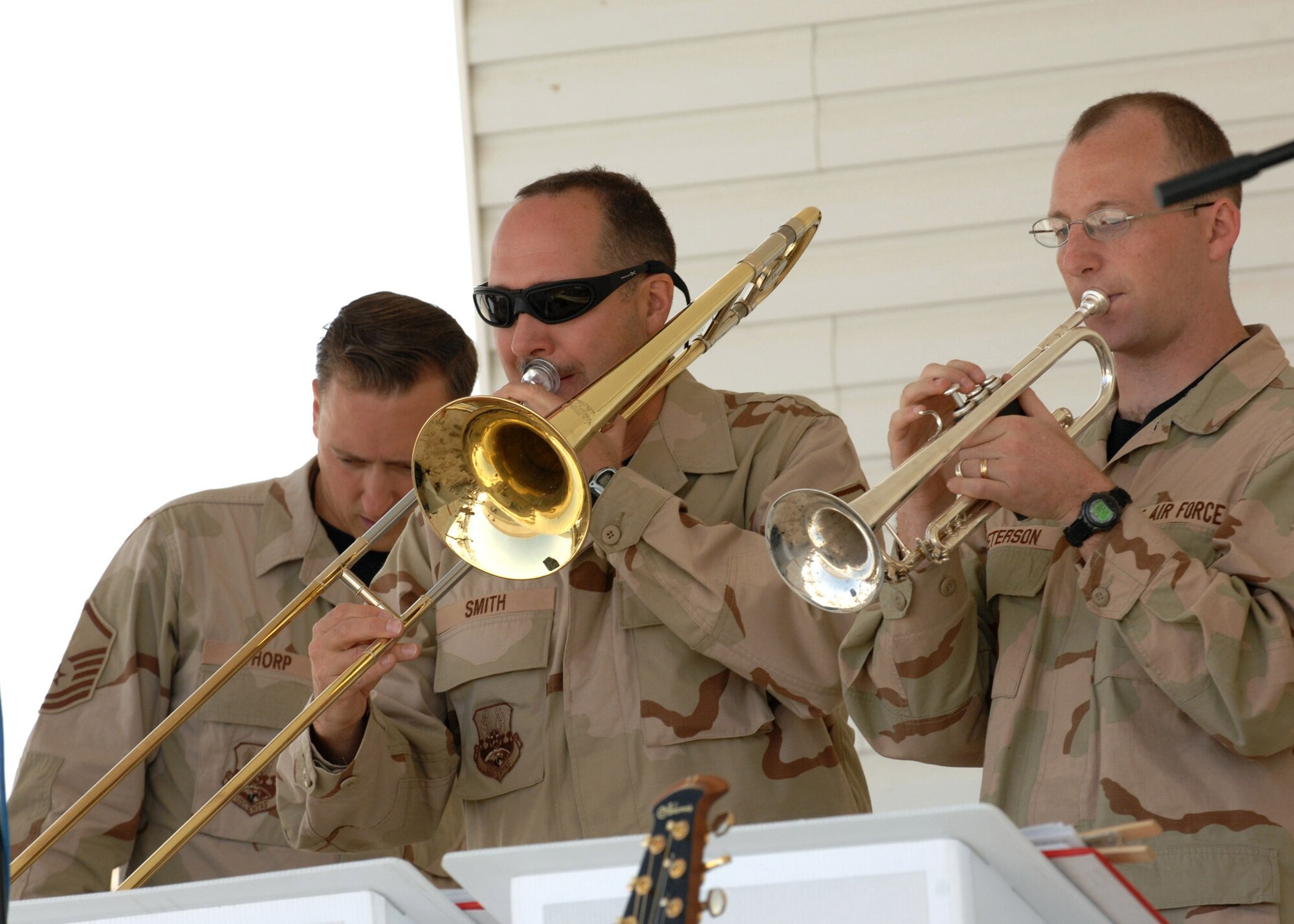 Master Sgt. Dean Smith (center), trombonist with U.S. Air Forces Central Band, performs for servicemembers during the band's recent visit to Kirkuk Air Base, Iraq. (U.S. Air Force photo by Senior Airman SerMae Lampkin) 