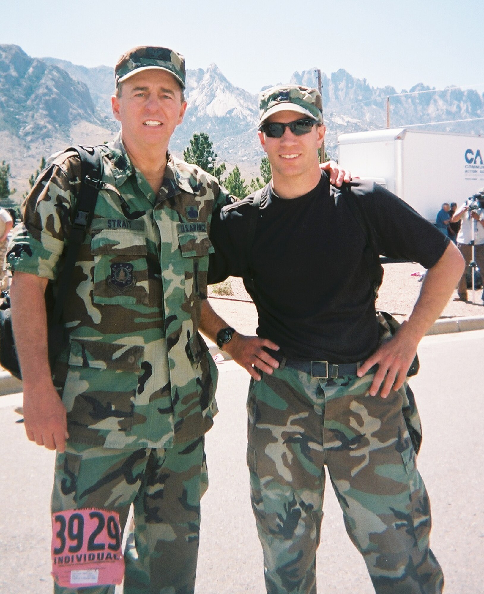Al Strait, 21st Space Wing director of staff (left), and Capt. John Zingarelli take a breather after completing the 26.2-mile Bataan Death March Memorial Marathon on White Sands Missile Range, N.M. March 30. The marathon march is held annually in remembrance of approximately 75,000 Filipino and U.S. Soldiers who surrendered to the Japanese forces on the island of Luzon. Later on as prisoners of war, the surrendered were forced to march about 100 kilometers north to Nueva Ecija to Camp O'Donnell, a prison camp, in the scorching heat through the Philippine jungles. Captain Zigarelli is assigned to the 21st Space Wing director of staff. (Courtesy photo)