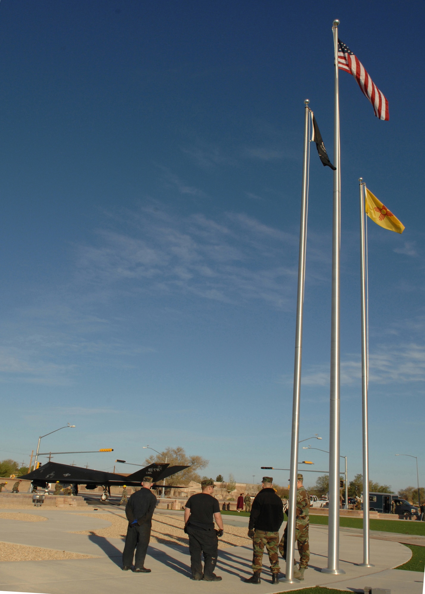 HOLLOMAN AIR FORCE BASE, N.M. -- Airmen from the 49th Maintenance Squadron watch as the F-117A is placed in its designated area in Heritage Park here April 5. The F-117A was moved to the park among many other retired aircraft because of its upcoming retirement. (U.S. Air Force photo by Airman Sondra M. Wieseler)