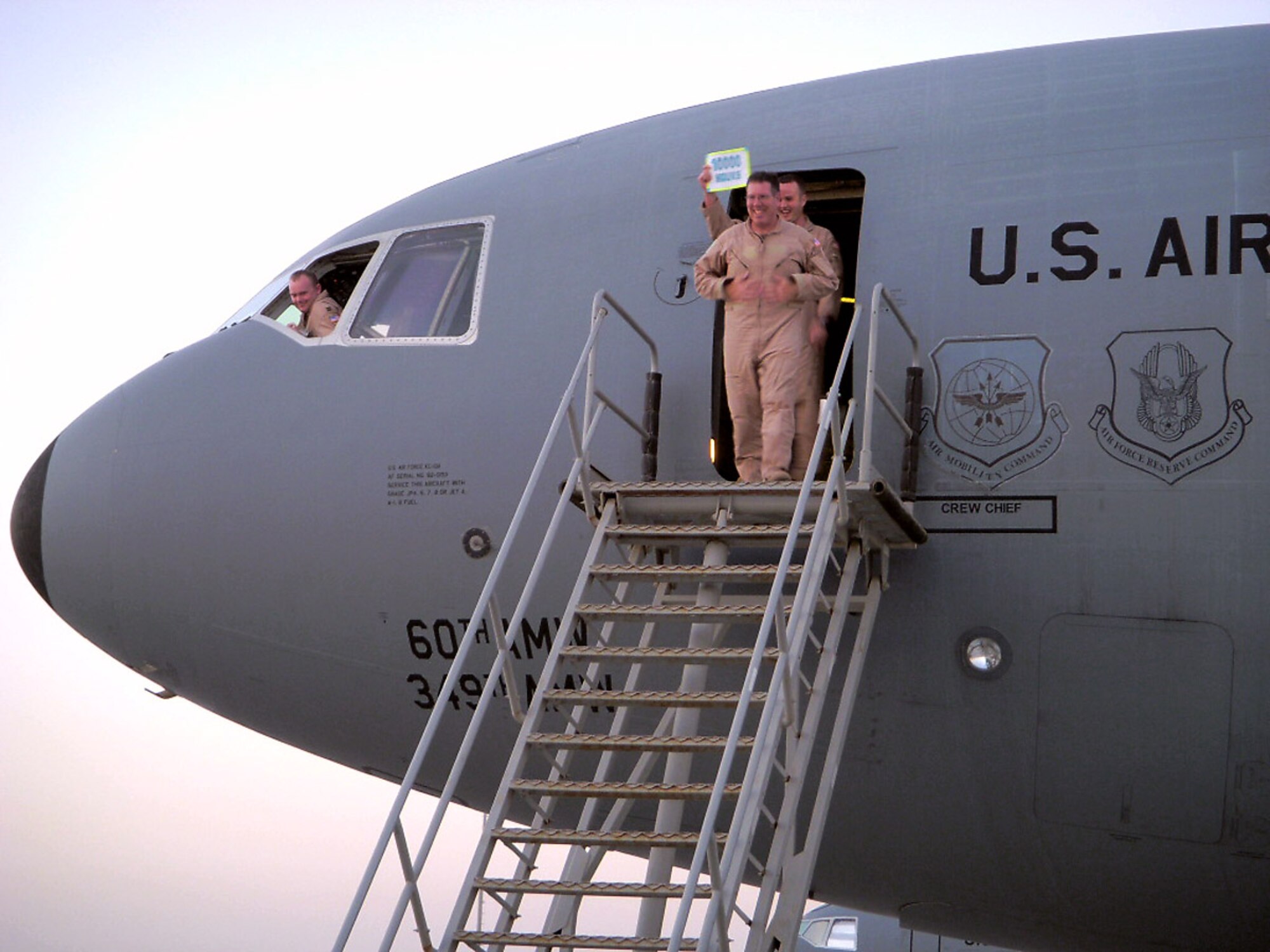 Senior Master Sgt. Robert Fisher, a flight engineer in the 908th Expeditionary Air Refueling Squadron at an air base in Southwest Asia, steps off a KC-10 Extender March 29 after his landmark flight where he surpassed 10,000 flight hours. (Courtesy photo)
