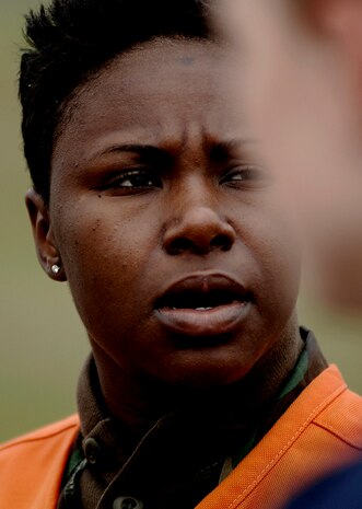 Staff Sgt. Erica Jones reacts to a simulated aircraft crash on the Charleston AFB flightline Tuesday. The simulated crash was a part of an exercise in preparation for the 2008 "Wings Over Charleston" Air Show. Sergeant Jones is an aeromedical technician with the 437th Medical Group. (U.S. Air Force photo/Senior Airman Nicholas Pilch)