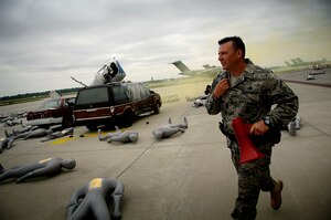 Master Sgt. Tony Mullins responds to a simulated aircraft accident on the Charleston AFB flightline Tuesday. Charleston Airmen participated in an exercise to prepare for the 2008 "Wings Over Charleston" Air Show. Sergeant Mullins is with the 437th Security Forces Squadron.  (U.S. Air Force photo/Senior Airman Nicholas Pilch)
