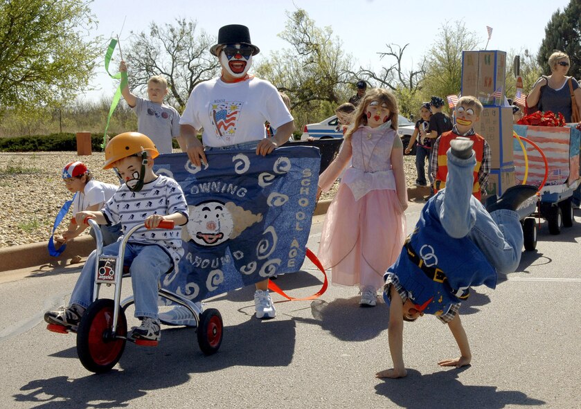 DYESS AIR FORCE BASE, Texas -- Ian Slaughter goes head over heels about the Month of Military Child parade April 4, 2008.  The parade sponsored by the 7th Services Squadron had more than 200 children participating from the Child and Development Center. One could find children ranging from 6 weeks to 10 years marching and riding down the streets of Dyess AFB.  The Month of the Military Child serves as a reminder that military kids are a vital part of the mission too.  (U.S. Air Force photo by Staff Sergeant Connor W. Estes)