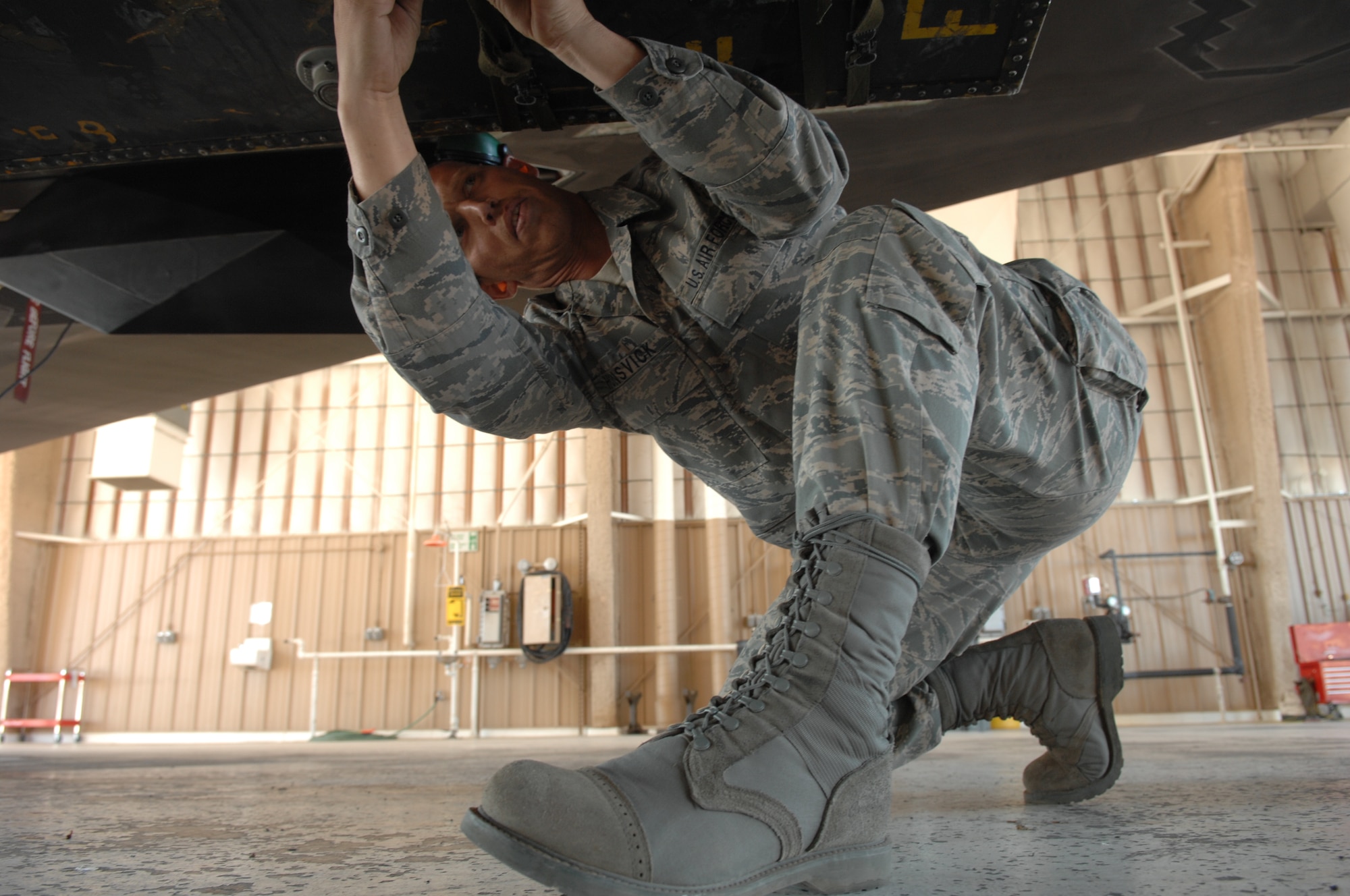 Tech. Sgt. Byron Honsvick, 49th Aircraft Maintenance Squadron, adjust cargo straps on the transportation sled on the bomb rack during Exercise Coronet Gold Rush 08-02, here March 28. It is commonly used during a deployment to carry the aircraft's covers, chocks, tools and sometimes even extra parts or the pilot's luggage. It is downloaded after the arrival and a bomb is put in its place.
(U.S. Air Force photo/Senior Airman Anthony Nelson Jr)