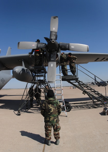 DYESS AIR FORCE BASE, Texas -- A group of C-130 engine mechanics fix an engine starter, April 4. Every pre-flight inspection is not perfect, as problems like engine starters or brake releases come into play and delay the aircraft. When a malfunction is reported a specialty shop will report to the flightline to fix it. (U.S. Air Force photo by Airman 1st Class Jennifer Romig)
