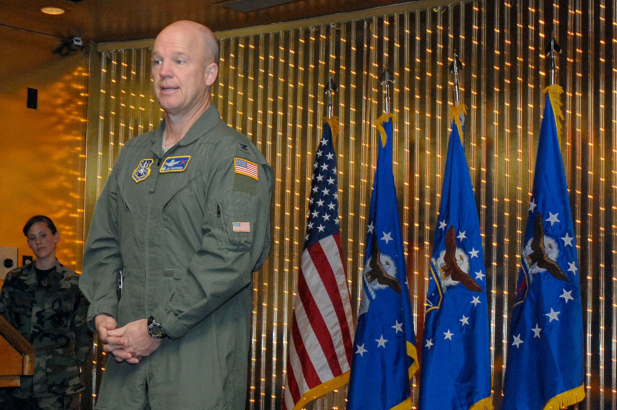 Col. Jay Raymond, 21st Space Wing commander, presents his closing remarks during the Peterson Company Grade Officers Professional Development Course graduation ceremony April 4 at the base club. Seventeen officers and one civilian equivalent in rank attend the course, a first for Peterson's professional development curriculum. (U.S. Air Force photo/Larry Hulst)