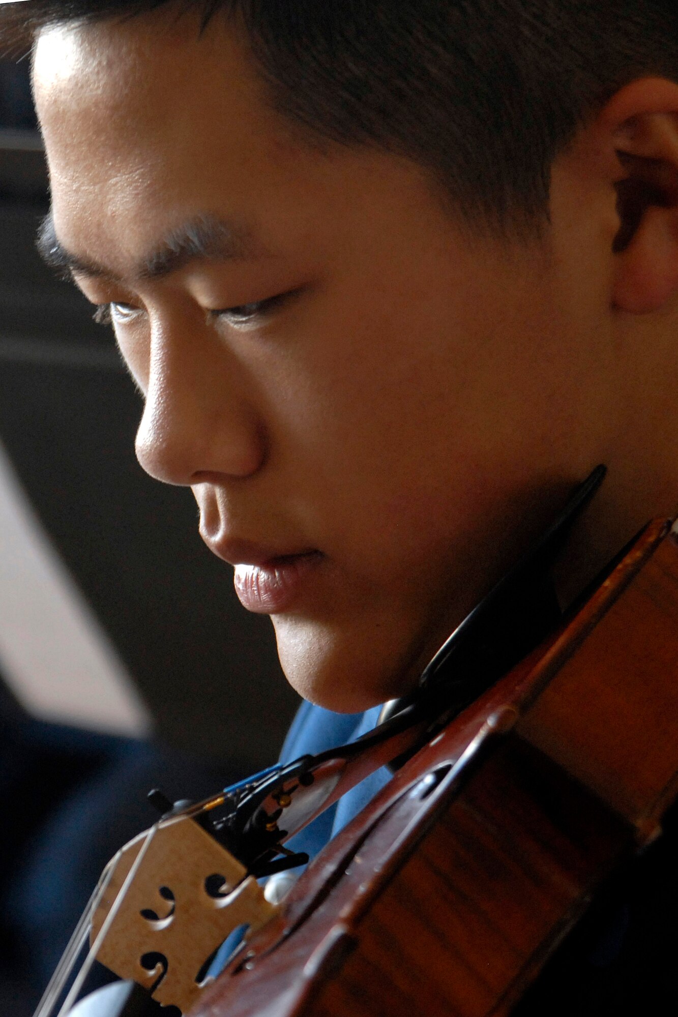 Freshman Joshua Ku plays the viola during the cadet sponsor social held April 5 in Arnold Hall at the U.S. Air Force Academy in Colorado. The social honored the 3,500 cadet sponsors; those men, women and families who open their hearts and homes to members of the cadet wing to enhance cadet life and develop officers of character. Cadet Ku is a member of the Cadet Orchestra. (U.S. Air Force photo/Mike Kaplan) 
