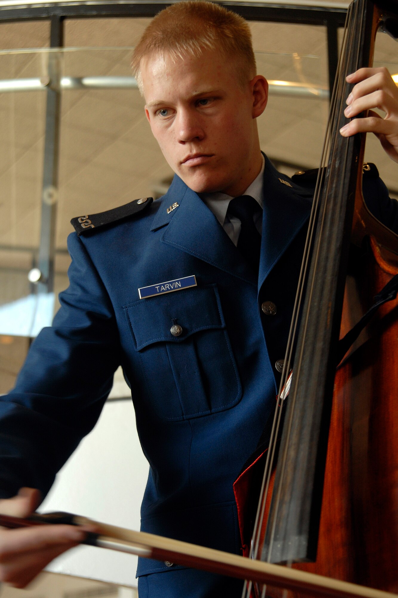 Freshman Peter Tarvin plays the bass during the cadet sponsor social held April 5 in Arnold Hall at the U.S. Air Force Academy in Colorado. The social honored the 3,500 cadet sponsors; those men, women and families who open their hearts and homes to members of the cadet wing to enhance cadet life and develop officers of character. Cadet Tarvin is a member of the Cadet Orchestra. (U.S. Air Force photo/Mike Kaplan) 
