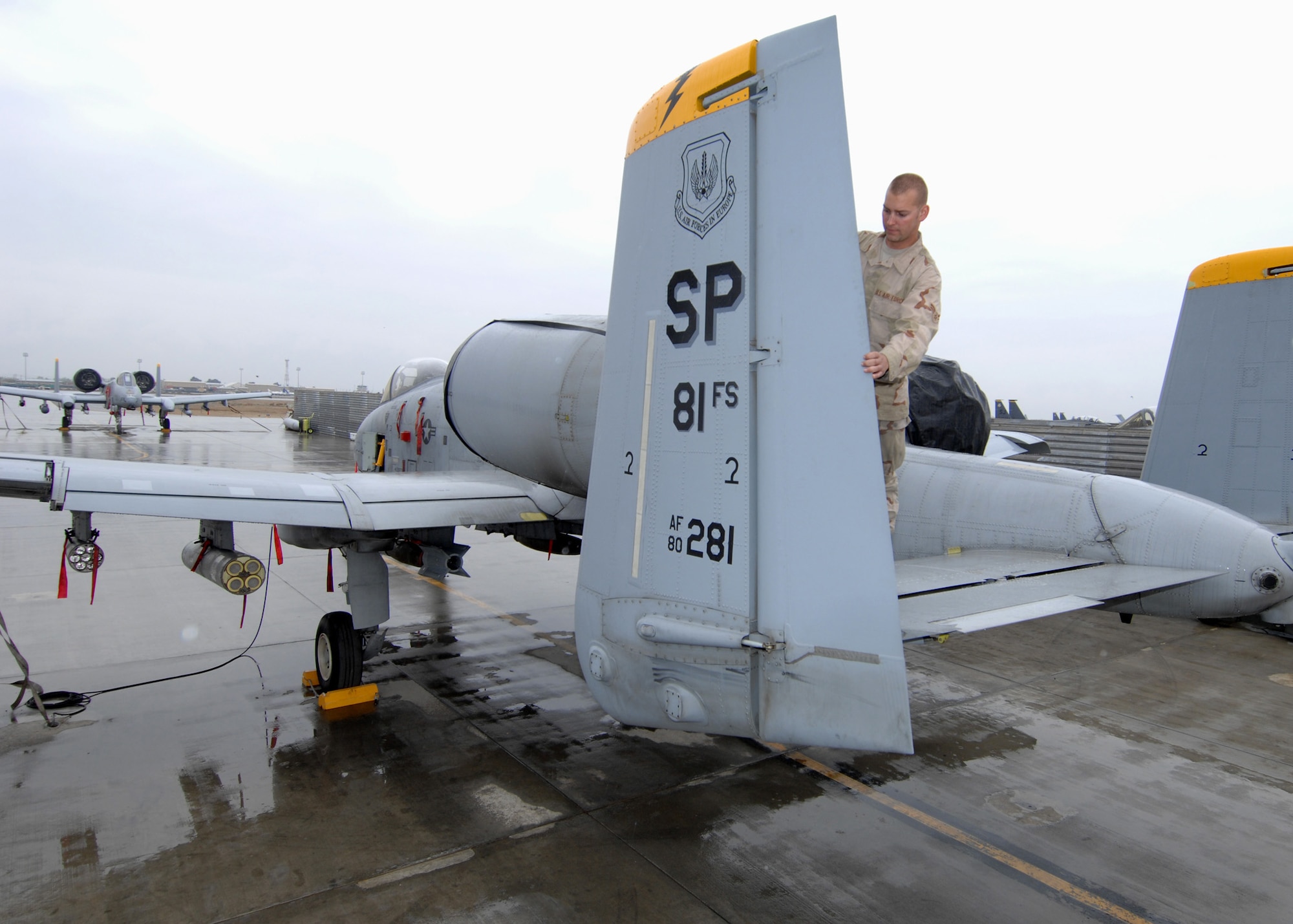 BAGRAM AIR BASE, Afghanistan - Airman 1st Class Sean Story, 81st Expeditionary Aircraft Maintenance Unit crew chief, inspects the rudder of the oldest A-10 in USAFE here April 9. Airman Story is deployed from the 81st Aircraft Maintenance Unit, Spangdahlem Air Base, Germany. (U.S. Air Force photo by Master Sgt. Demetrius Lester)