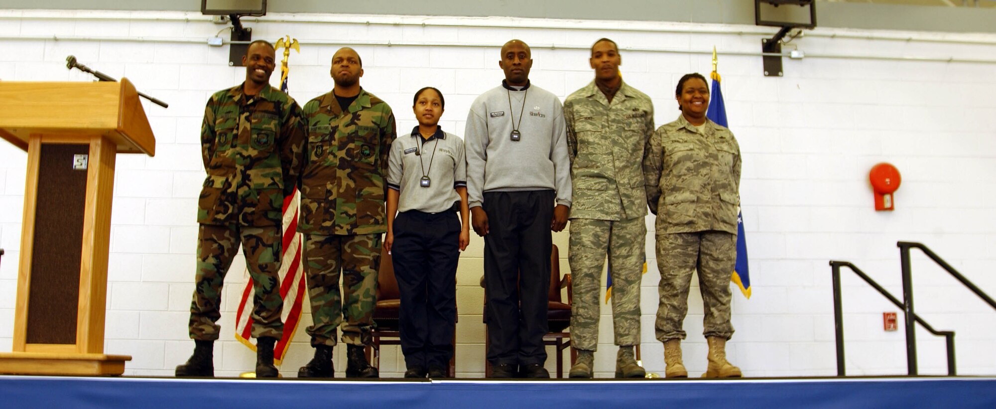 ANDREWS AIR FORCE BASE, Md. --Members of the 459th Services Flight receive kudos onstage in Hangar 11 here during  "Tribute to Troops," an event hosted by the 459th Mission Support Flight to thank returning troops for their various deployments during the last year. The event was emceed by Senior Airman Patrick Stout (not shown) of the 69th Aerial Port Squadron. (U.S. Air Force photo/Senior Airman Ashley Crawford)