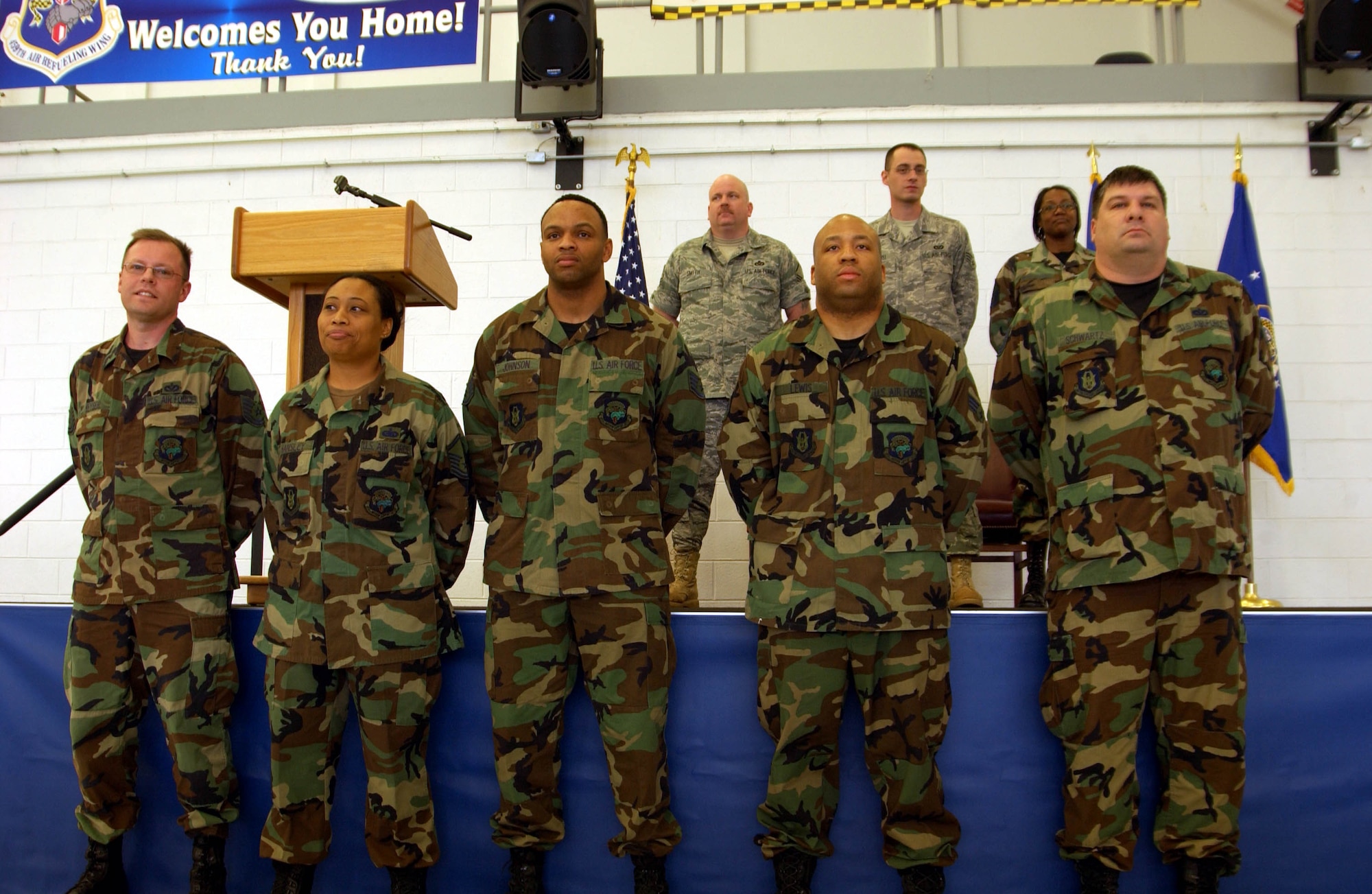 ANDREWS AIR FORCE BASE, Md. -- Members of the 459th Civil Engineer Squadron receive kudos onstage during  "Tribute to Troops," an event hosted by the 459th Mission Support Flight to thank returning troops for their various deployments during the last year. The event was emceed by Senior Airman Patrick Stout (not shown) of the 69th Aerial Port Squadron. (U.S. Air Force photo/Senior Airman Ashley Crawford)