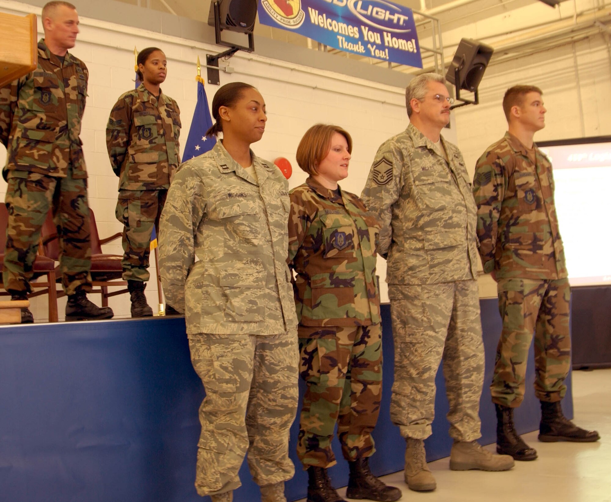 ANDREWS AIR FORCE BASE, Md. -- Members of the 459th Logistics Readiness Flight listen to their accomplishments read during  "Tribute to Troops," an event hosted by the 459th Mission Support Flight to thank returning troops for their various deployments during the last year. The event was emceed by Senior Airman Patrick Stout (not shown) of the 69th Aerial Port Squadron. The 459th LRF will travel to Royal Air Force Mildenhall, England, Friday to support the 100th Logistics Readiness Squadron. (U.S. Air Force photo/Senior Airman Ashley Crawford)