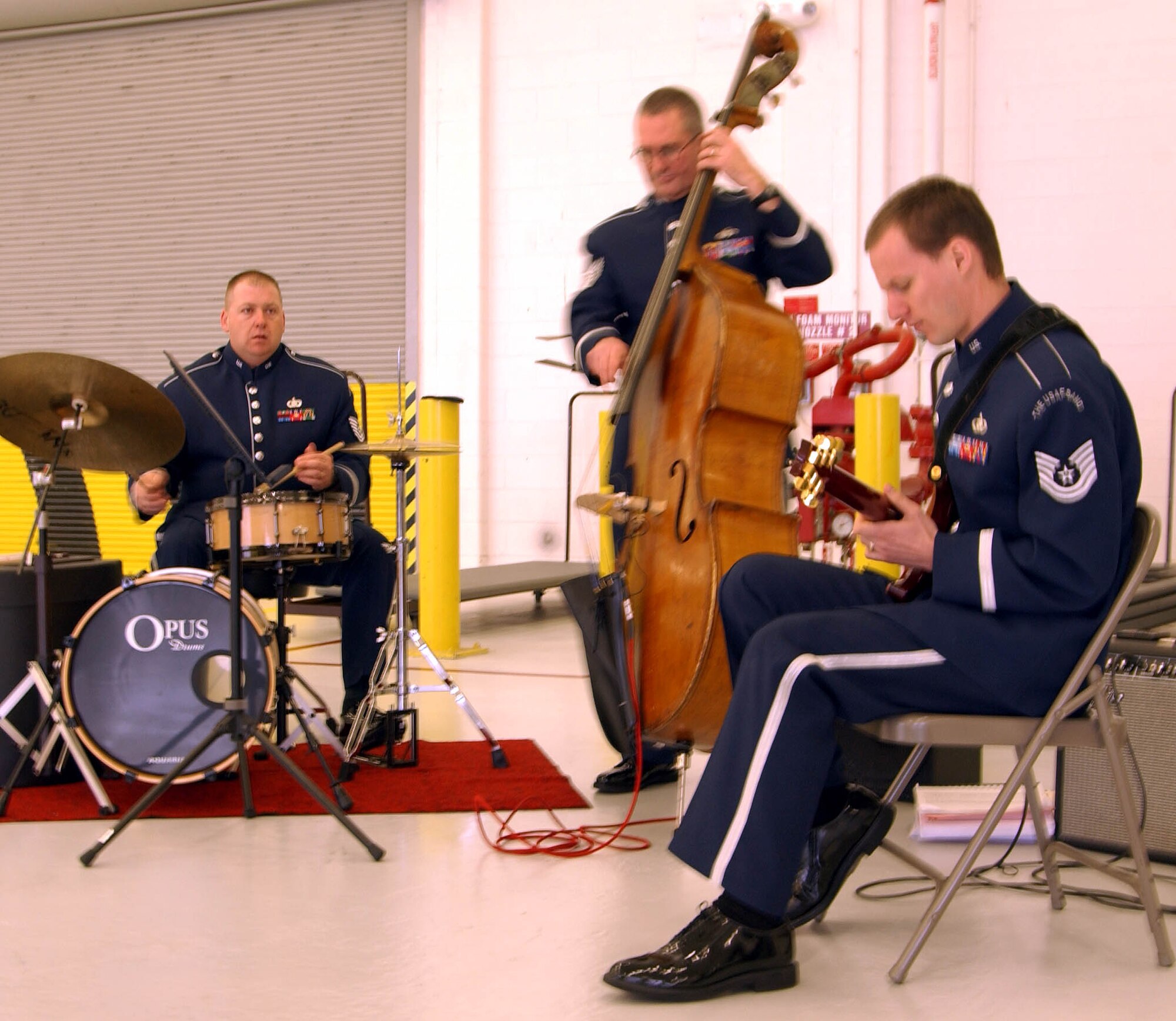 ANDREWS AIR FORCE BASE, Md. -- The Air Force Band "Max Impact" performs during  "Tribute to Troops," an event hosted by the 459th Mission Support Flight to thank returning troops for their various deployments during the last year. The event was emceed by Senior Airman Patrick Stout of the 69th Aerial Port Squadron. (U.S. Air Force photo/Senior Airman Ashley Crawford)