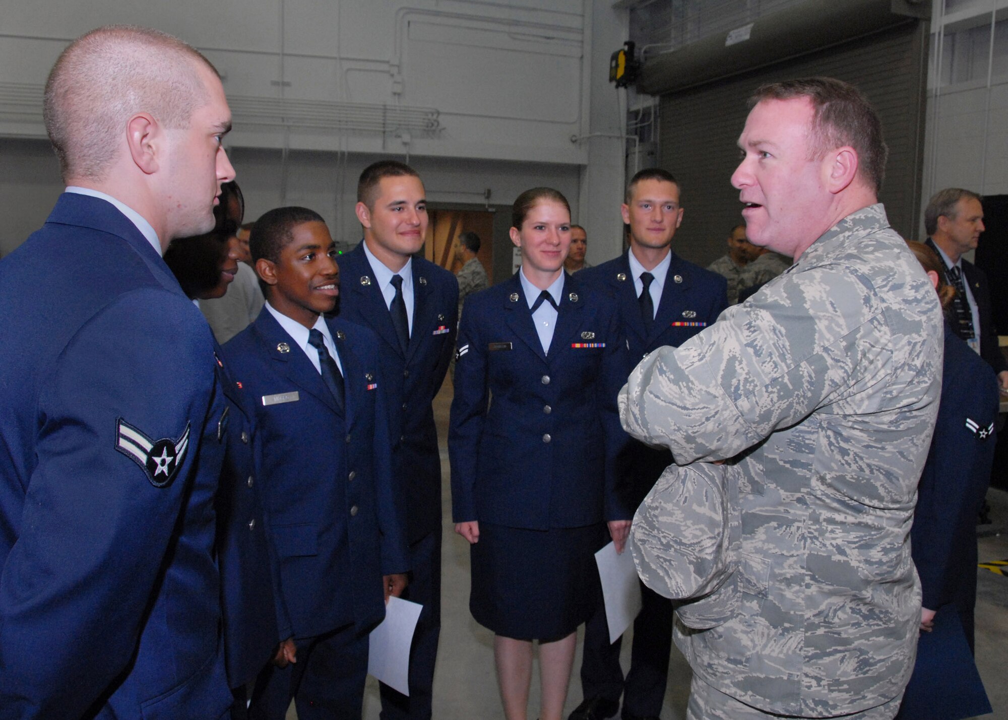 Lt. Col. Thomas Ventriglia speaks with students graduating from the F-22 Raptor Armament Systems course April 7 at Sheppard Air Force Base, Texas. The eight Airmen are the first Raptor maintenance class to graduate from the brand-new $21 million Raptor Maintenance Training Facility. Colonel Ventriglia is the 363rd Training Squadron commander. (U.S. Air Force photo/Mike Litteken) 
