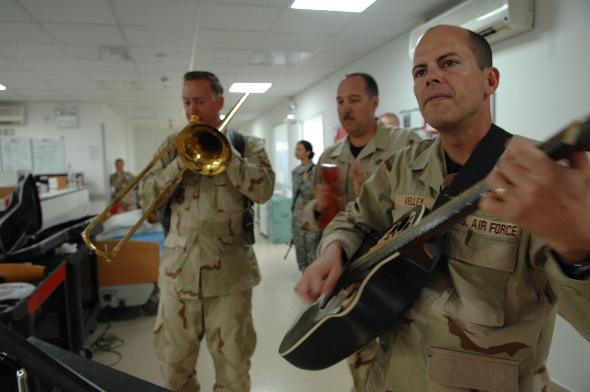 BALAD AIR BASE, Iraq -- Three members of Hot Brass, U.S. Air Forces Central Band, perform for staff and patients at the Air Force Theater Hospital here, April 8.  The band is touring various locations throughout Southwest Asia and Africa. Members of Hot Brass are deployed from Scott Air Force Base, Ill. (U.S. Air Force photo/ Senior Airman Julianne Showalter)