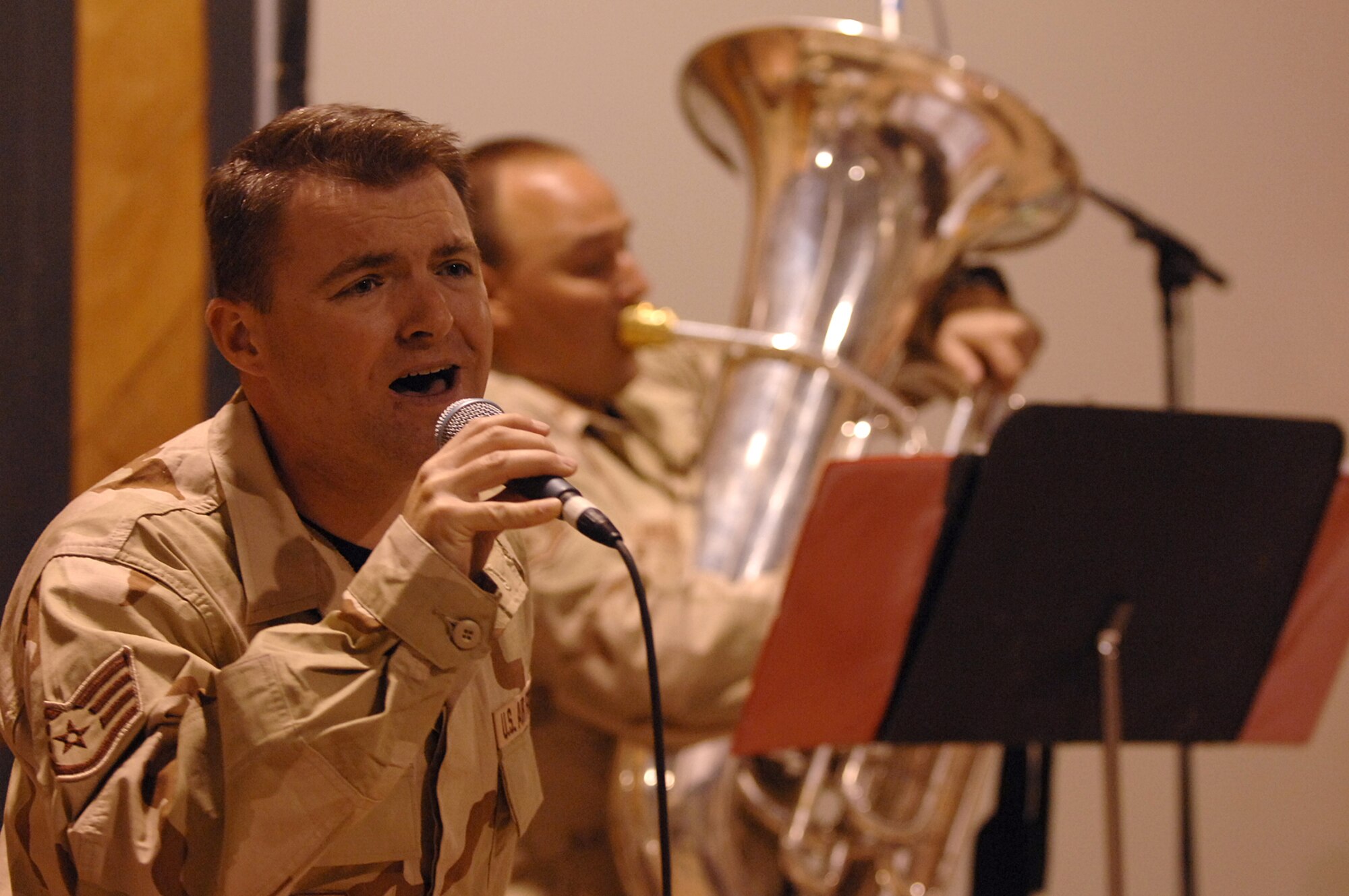 BALAD AIR BASE, Iraq -- Staff Sgt. James Gilley, U.S. Air Forces Central Band Hot Brass, sings for servicemembers here, April 8. Hot Brass came to Balad to bring smiles and relaxation for all personnel. The band is deployed from Scott Air Force Base, Ill. (U.S. Air Force photo/ Senior Airman Julianne Showalter)