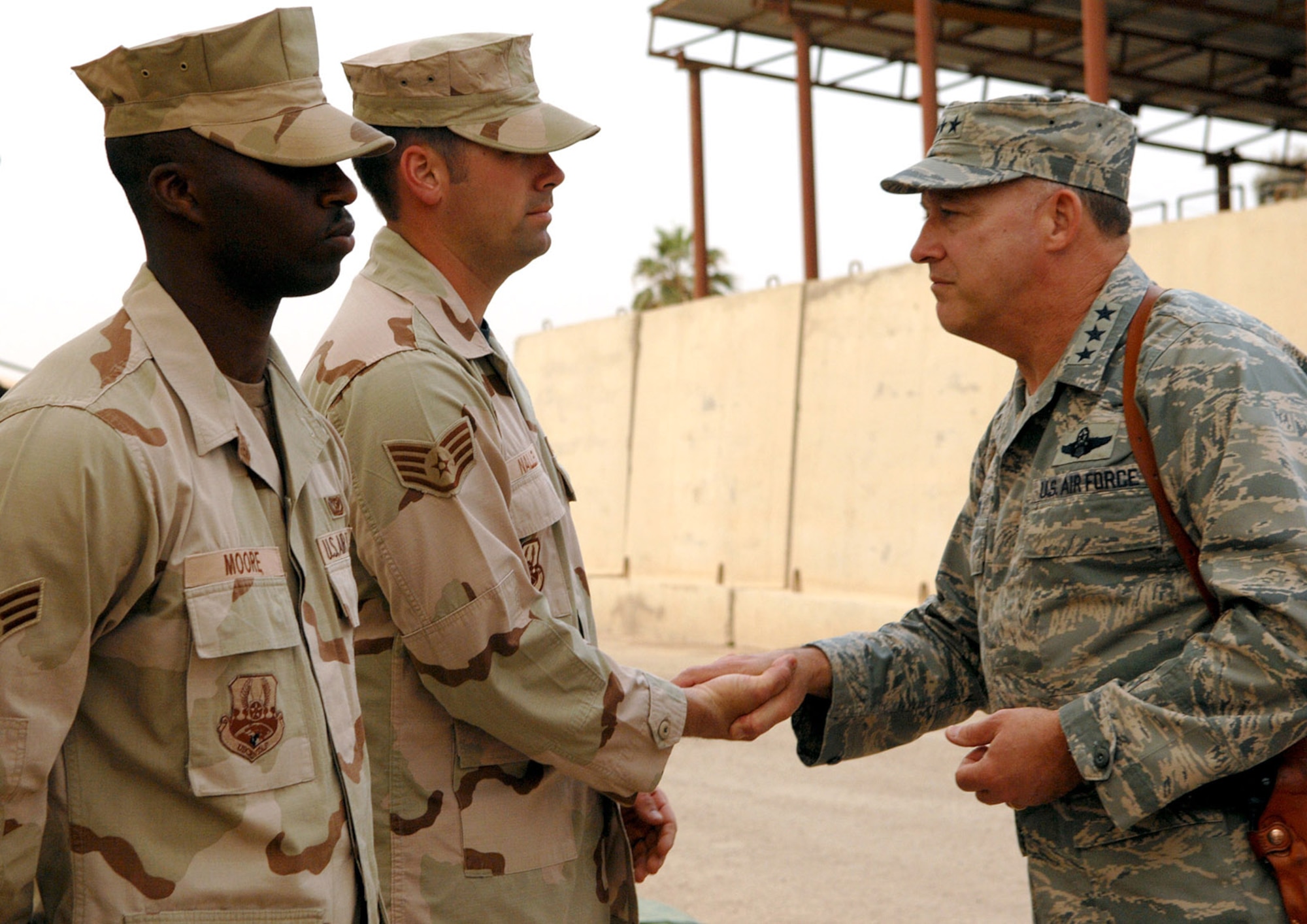 Lt. Gen. Gary North, U.S. Air Forces Central and 9th Air Force commander, meets Senior Airman Damean Moore and Staff Sgt. Michael Nalley, 506th Civil Engineer Squadron fire department, during his visit April 7 here. General North’s visit included stops to the 506th Expeditionary Medical Squadron Freedom Hospital, Control Tower, 506th Expeditionary Civil Engineer Firehouse, Coalition Air Forces facilities used for training Iraqi student pilots, and a U.S. Army tactical operation center manned by the 1st Brigade, 10th Mountain Division. (U.S. Air Force photo by Senior Airman SerMae Lampkin)