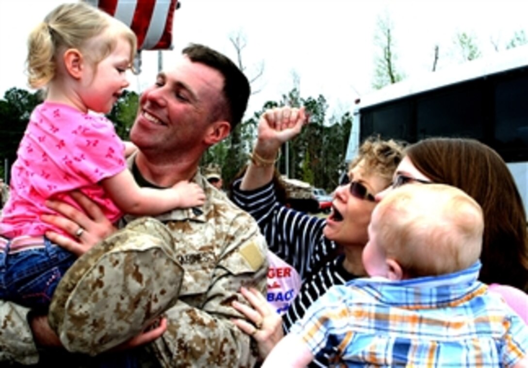 U. S. Marine Sgt. Aaron Letteer is welcomed home by his family, Camp Lejeune, N.C., April 4, 2008. Letteer was deployed to Iraq with 2nd Intelligence Battalion, II Marine Expeditionary Force for more than six months in support of Operation Iraqi Freedom. 