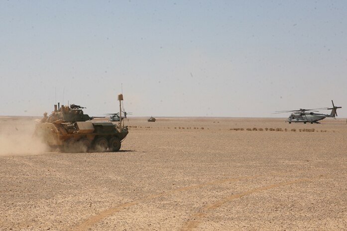 A Light Armored Vehicle 25 A2 from Charlie Company, 2nd Light Armored Reconnaissance Battalion, Regimental Combat Team 5, drives off to be refueled during a re-supply mission in western Anbar province, Iraq, April 9. A new site for LAV-25's weapon system was used by Charlie Company during Mojave Viper's at Marine Air Ground Combat Center, Twentynine Palms, Calif., ensuring gunners would be efficient with the sites for deployment.