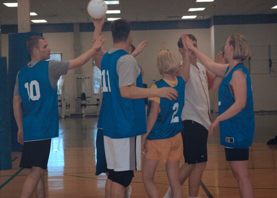 FAIRCHILD AIR FORCE BASE, Wash. – Volleyball team members from the 92nd Medical Group and the 92nd Security Forces exchange “high-fives” after a game at the Fitness Center here April 9. The 92nd MDG won the game against the 92nd SFS, retaining their uncontested winning record. (U.S. Air Force photo / Airman 1st Class Darlene West)