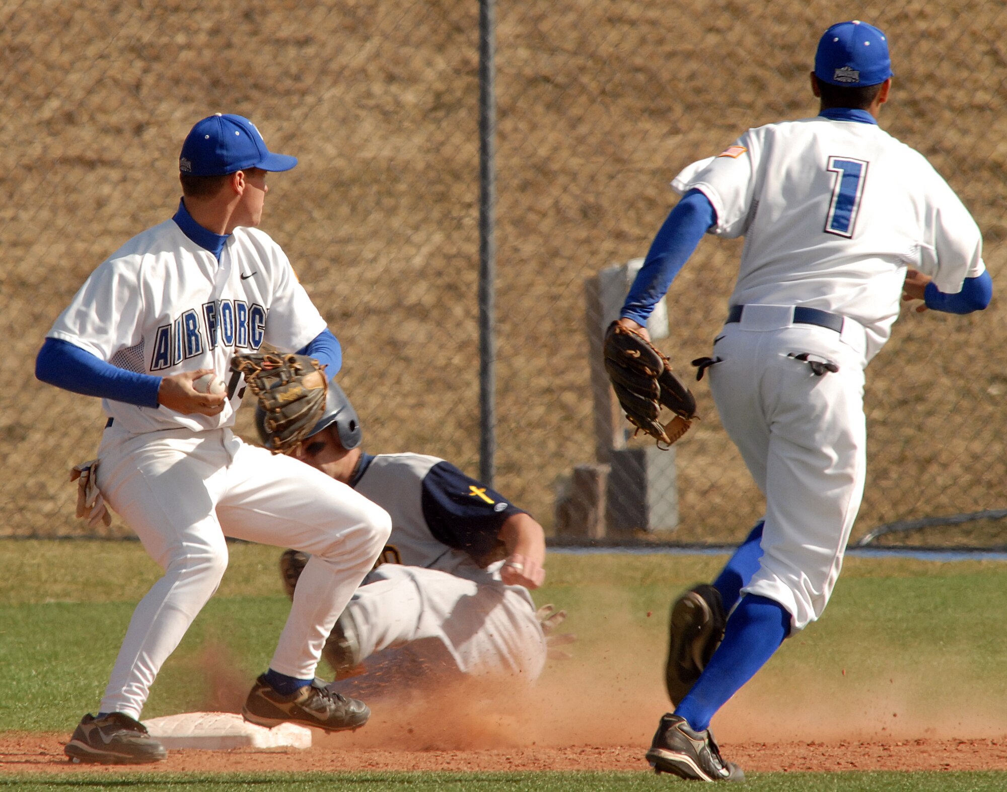 Freshman second baseman Nathan Carter throws to first to complete the double play as the Falcons rallied to a 10th inning 9-8 win against Colorado Christian in non conference baseball action at the Academy's Falcon Field. Carter went 1 for 5 as Air Force tallied 12 hits and did not commit an error in the field on the day. The Falcons improve to 11-19 on the season. (U.S. Air Force photo/Dave Ahlscwhede)