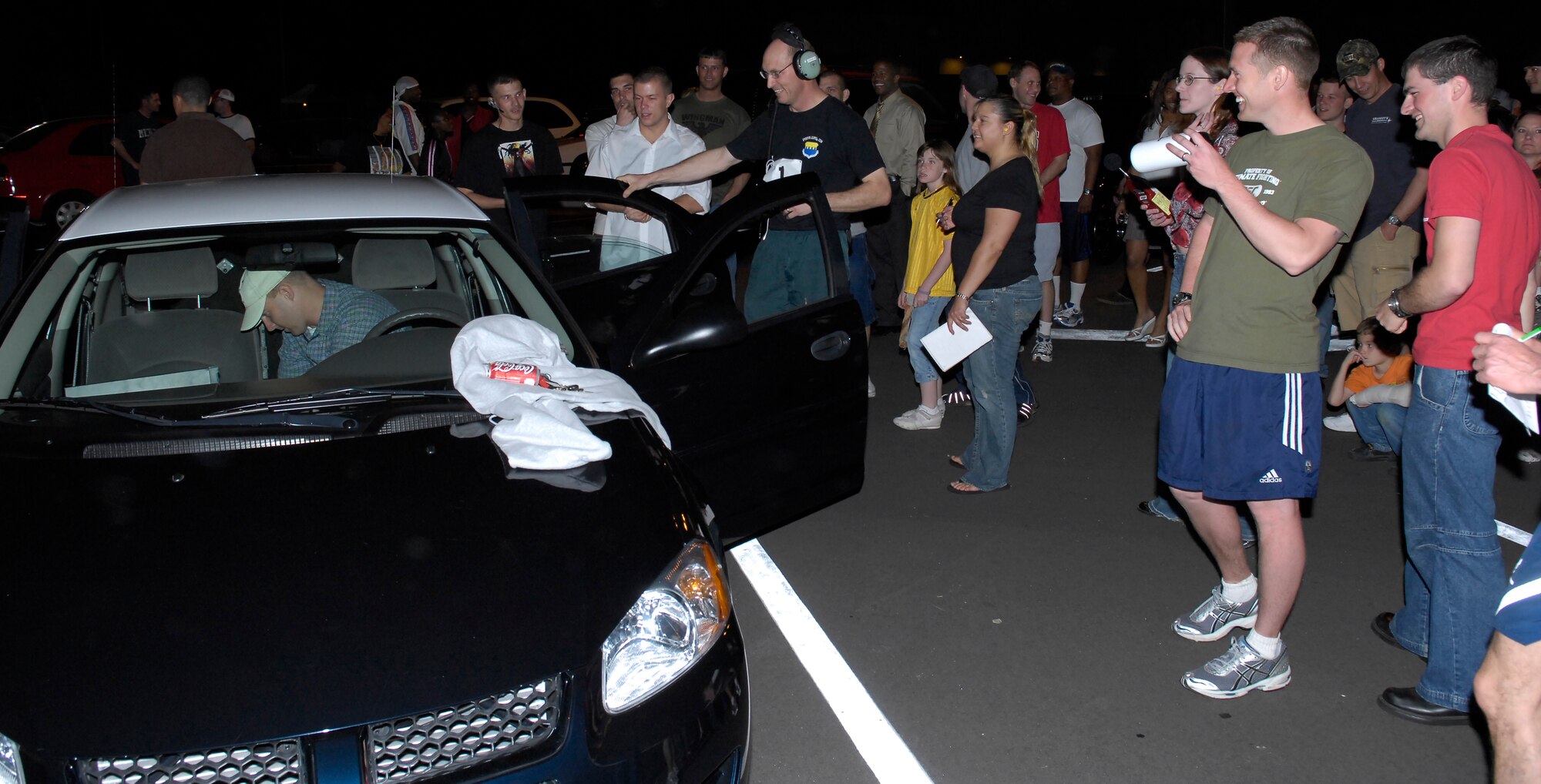Col. Timothy Zadalis, 43rd Airlift Wing Commander, looks on with the rest of the crowd during the Loudest Speaker Competition, which was part of the 2007 Pope Endurance Relay. The event will return as part of “The Extra Mile,” the 2008 endurance relay, which kicks off April 24 at 3 p.m. at the the Pope Fitness Center track. (43rd Airlift Wing File Photo)
