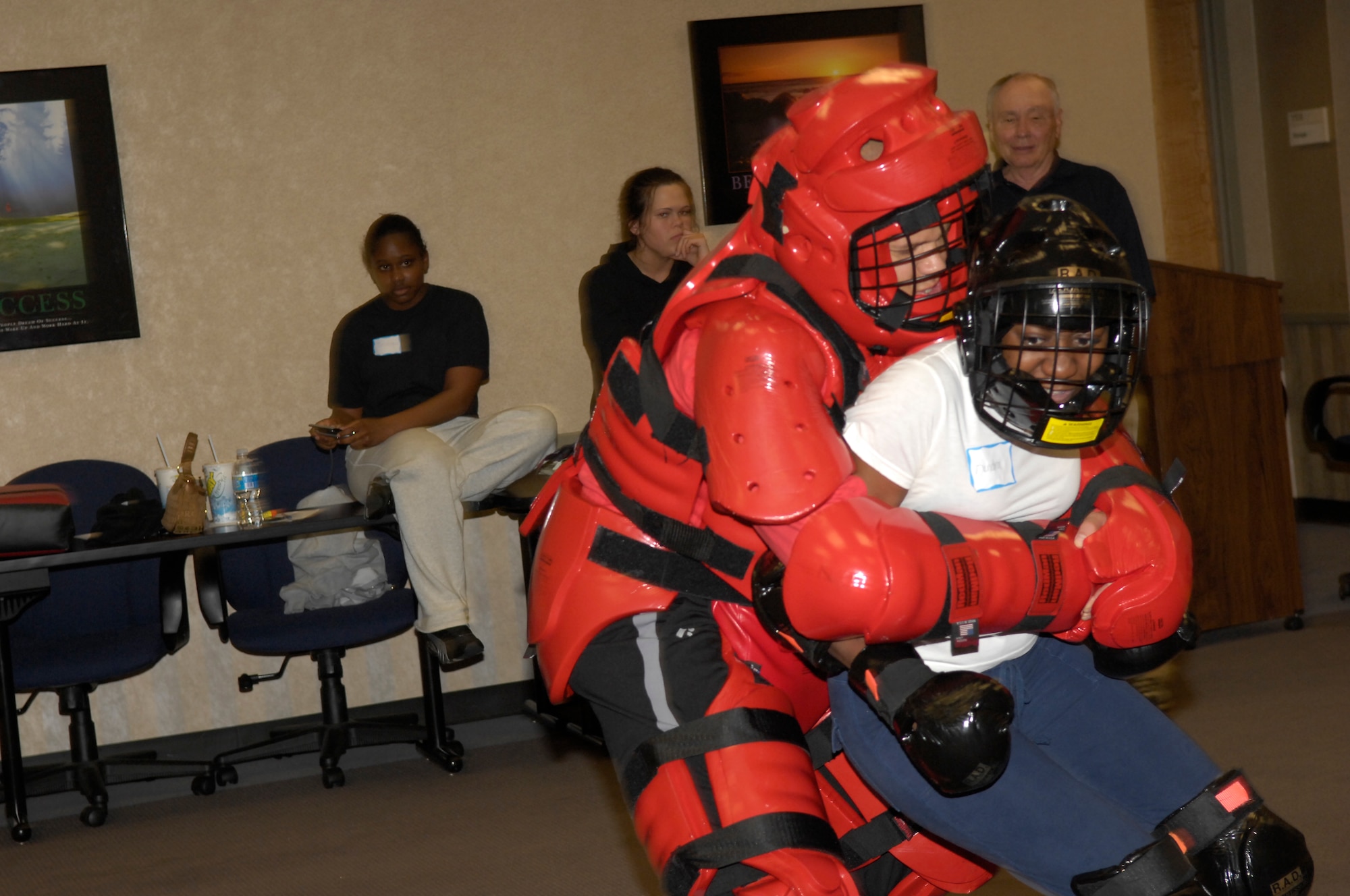 Tech. Sgt. Kendra Wilson, 43rd Airlift Wing, tries to ward off an attack from  Tony Davis, one of the instructors, at the Rape Aggression Defense class held at the Airman and Family Readiness Center April 4 and 5. (U.S. Air Force Photo by Airman 1st Class Mindy Bloem)
