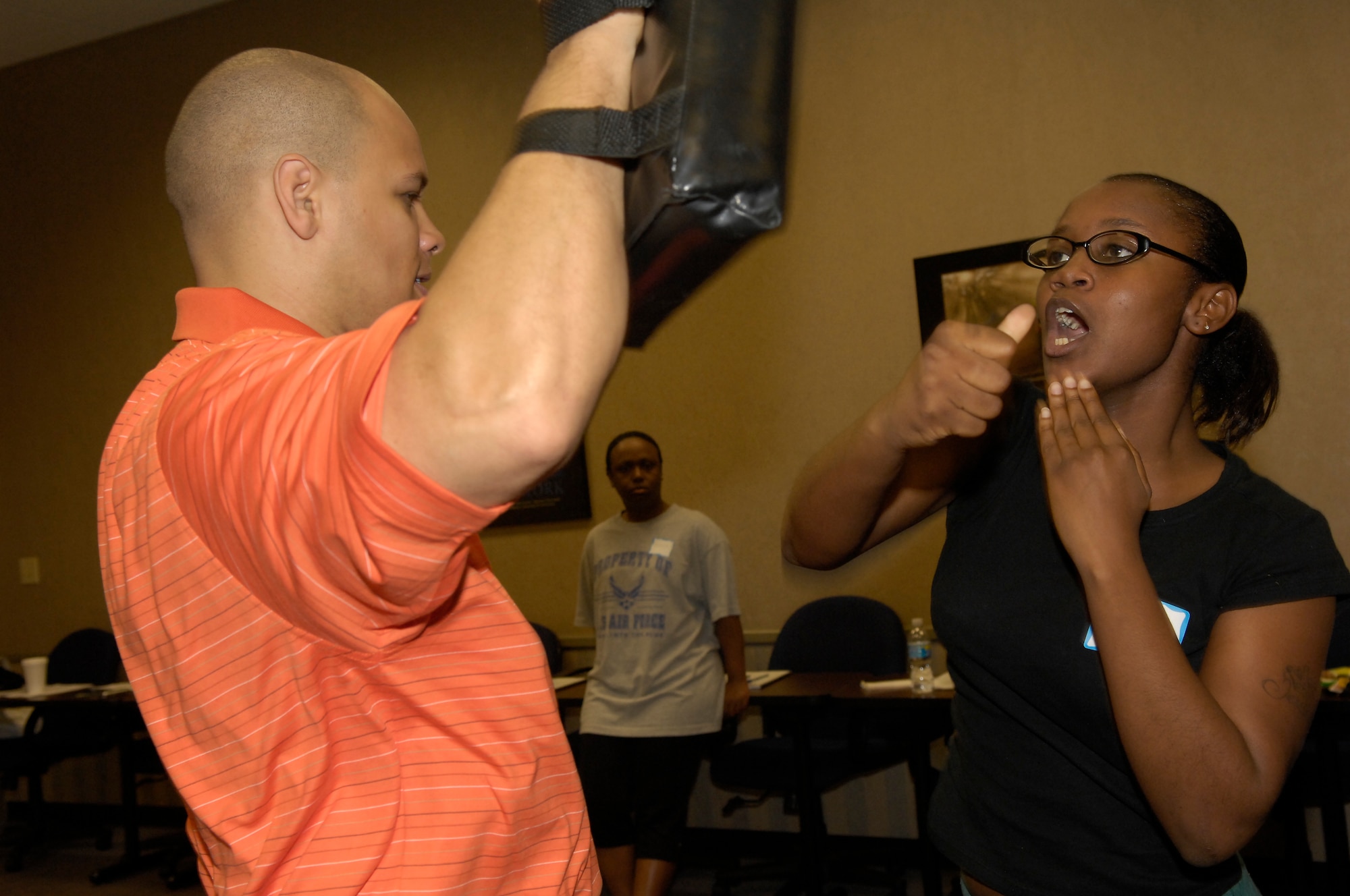 Airman 1st Class Jessica Harbison, 43rd Logistics Readiness Squadron, 
practices her striking motion on Tony Davis, one of the instructors, at the Rape Aggression Defense class held at the Airman and Family Readiness Center April 4 and 5. (U.S. Air Force Photo by Airman 1st Class Mindy Bloem)
