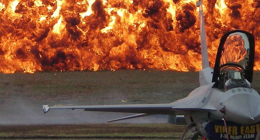 NAS MERIDAN, MISS.-- A pyrotechnics display is set off behind the Viper East Demonstration F-16. The airshow was held on Mar. 29 at Naval Air Station, Mississippi. (U.S. Air Force photo/Master Sgt. Bryan Spangler)