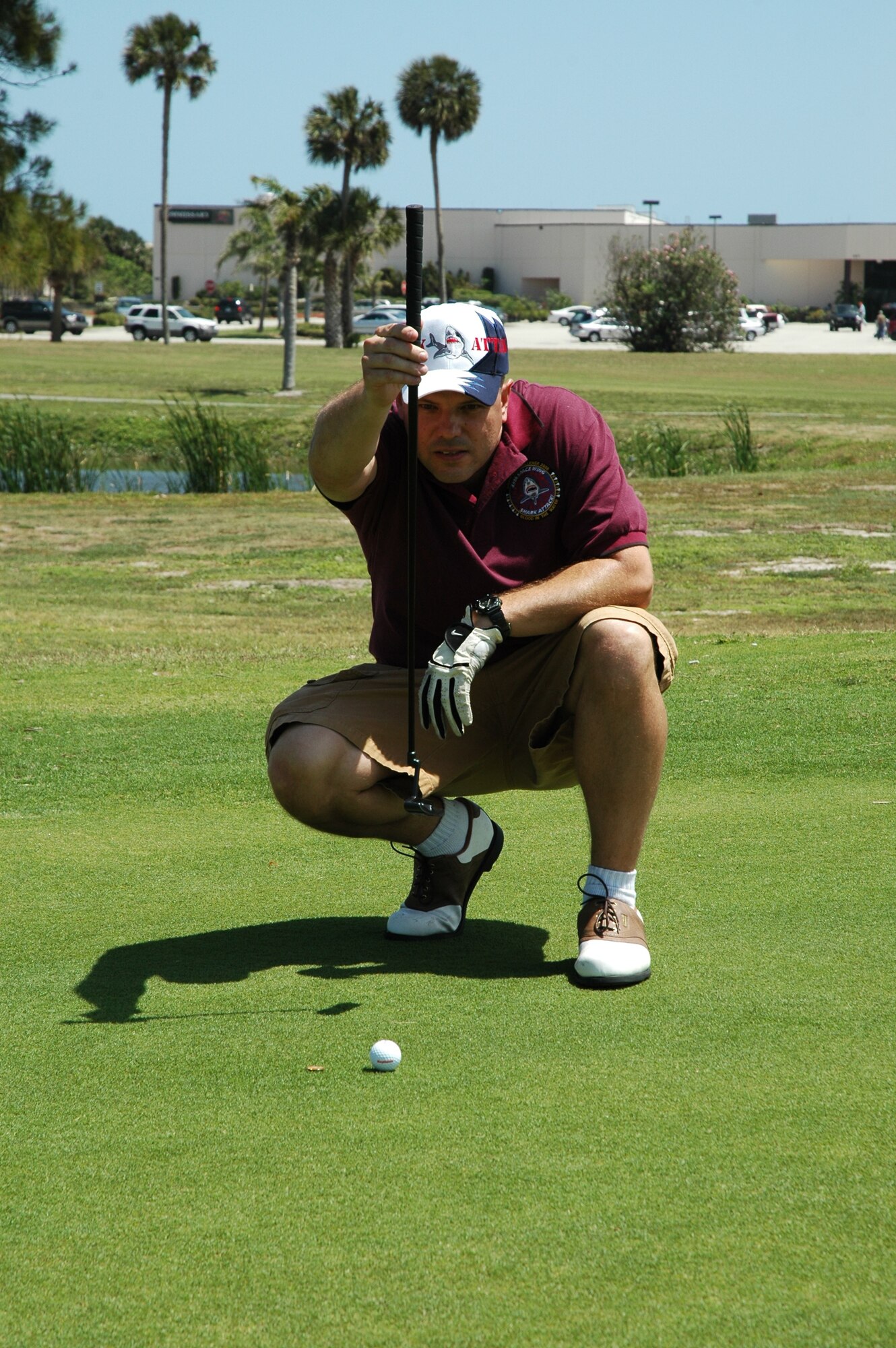 PATRICK AIR FORCE BASE, Fla. - Tech. Sgt. Rick Edgington of the 45th Launch Support Squadron lines up a putt at the Guardian Challenge Golf Tournament April 4 at the Manatee Cove Golf Course here. (U.S. Air Force photo by Airman 1st Class David Dobrydney)
