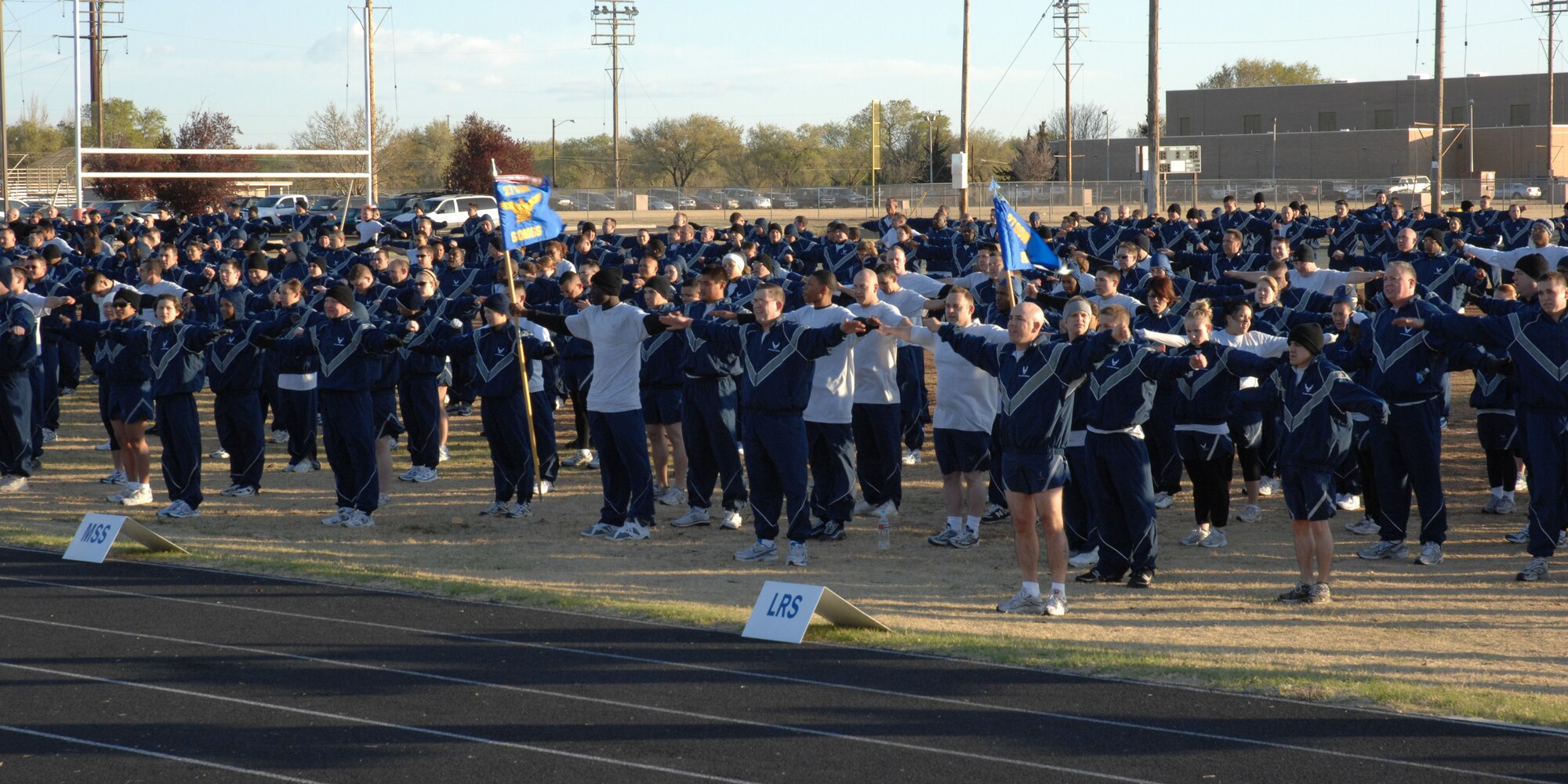 CANNON AIR FORCE BASE, N.M.-- Airmen stretch for the first wing-wide commando run April 10. The purpose of the commando run was to boost morale and camarederie among the base Airmen. (U.S. Air Force photo by Airman 1st Class Evelyn Chavez)