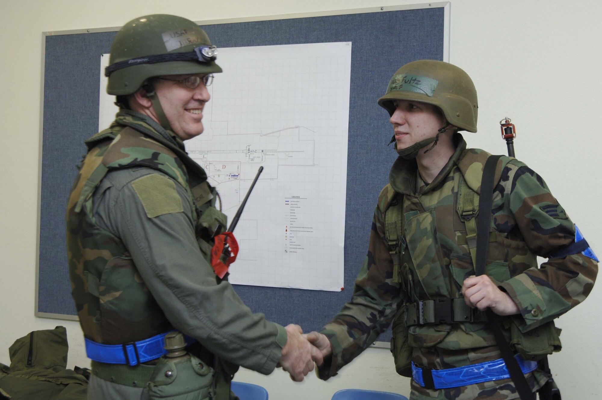 VOLK FIELD AIR NATIONAL GUARD BASE, Wis. -- Col. Ray LaMarche Jr., the commander for “Real Deal” exercise at Volk Field greets Senior Airman David Fultz, from the personnel contingency team on April 4 during the commanders walk around.  PERSCO tracks military members’ duty status and force strength. (Photo by Tech. Sgt. Chyrece Campbell)