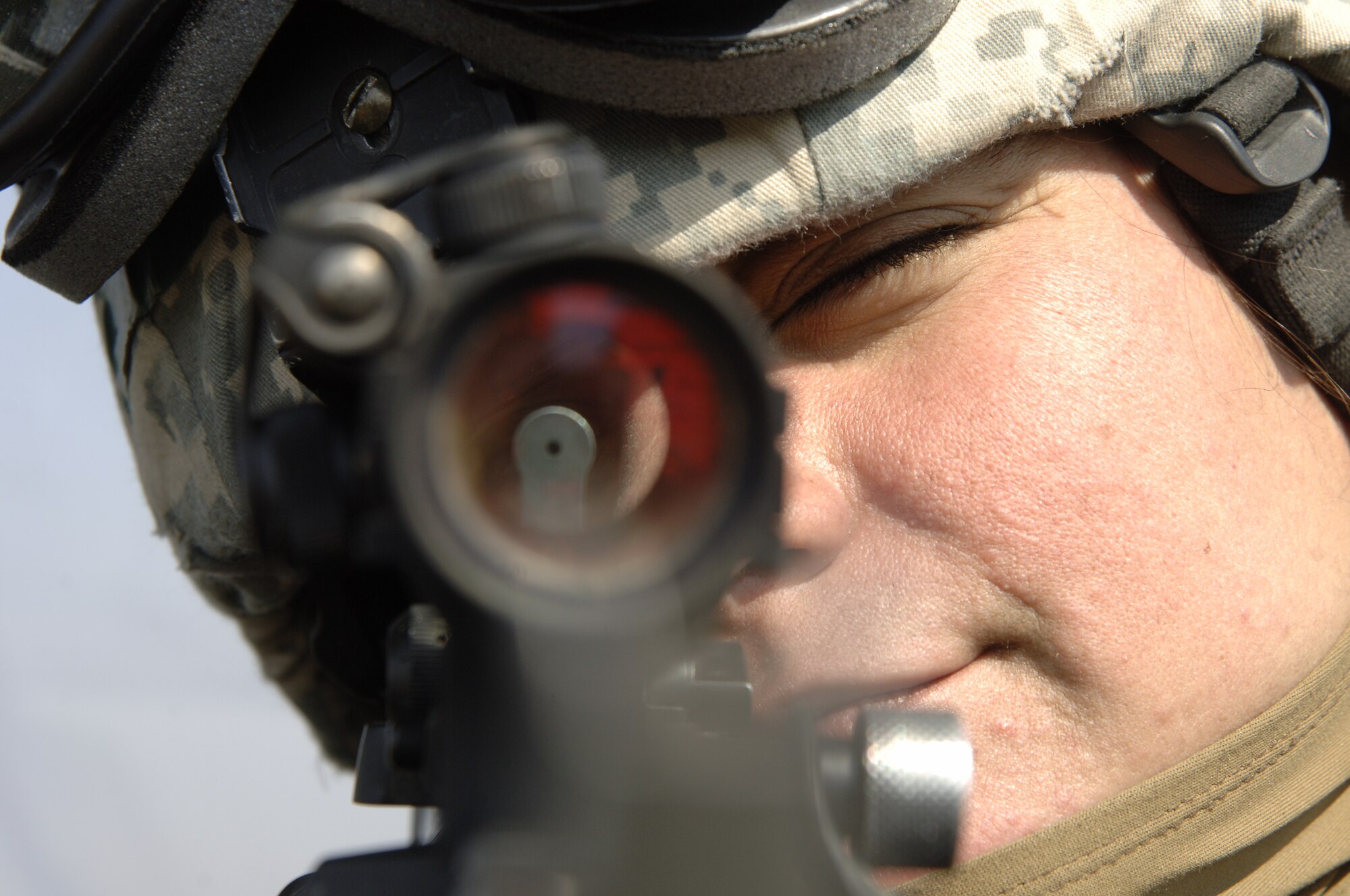 VOLK FIELD AIR NATIONAL GUARD BASE, Wis. -- Senior Airman Amyrose Meier, a Security Force member, looks through a sight on her M-4 during an exercise at Volk Field on April 4.  As personnel perform their daily missions, Security Forces Squadron is responsible for the protection of members and the base.  (Photo by Tech. Sgt. Chyrece Campbell)