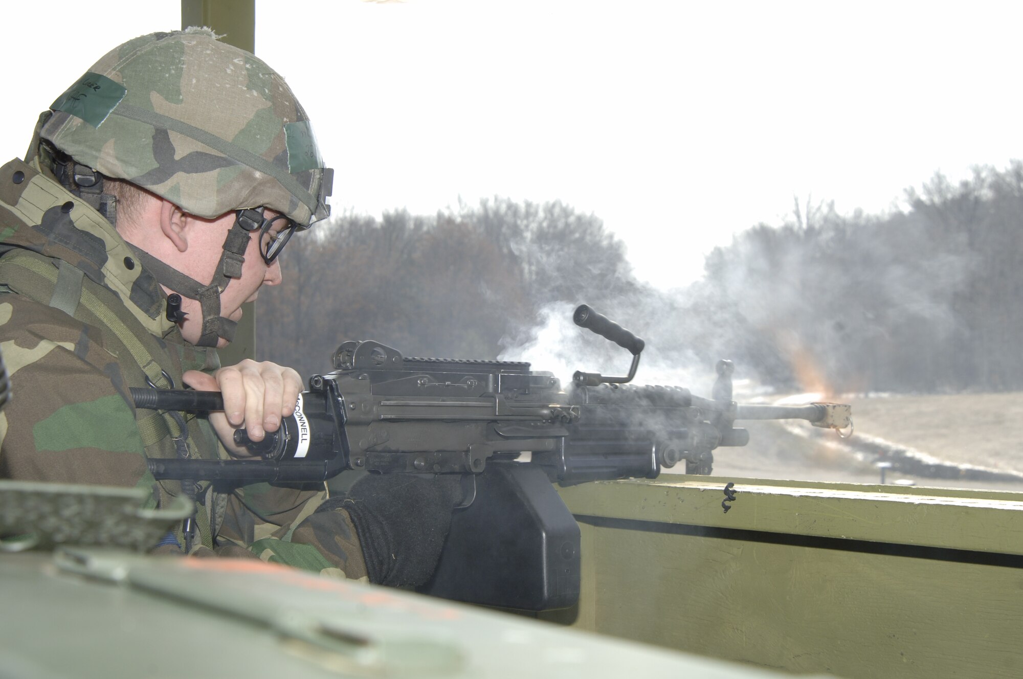 VOLK FIELD AIR NATIONAL GUARD BASE, Wis. -- Staff Sgt. Jason Umlauf, a Security Force member, fires an M-249 during an exercise at Volk Field on April 4.  (Photo by Tech. Sgt. Chyrece Campbell)