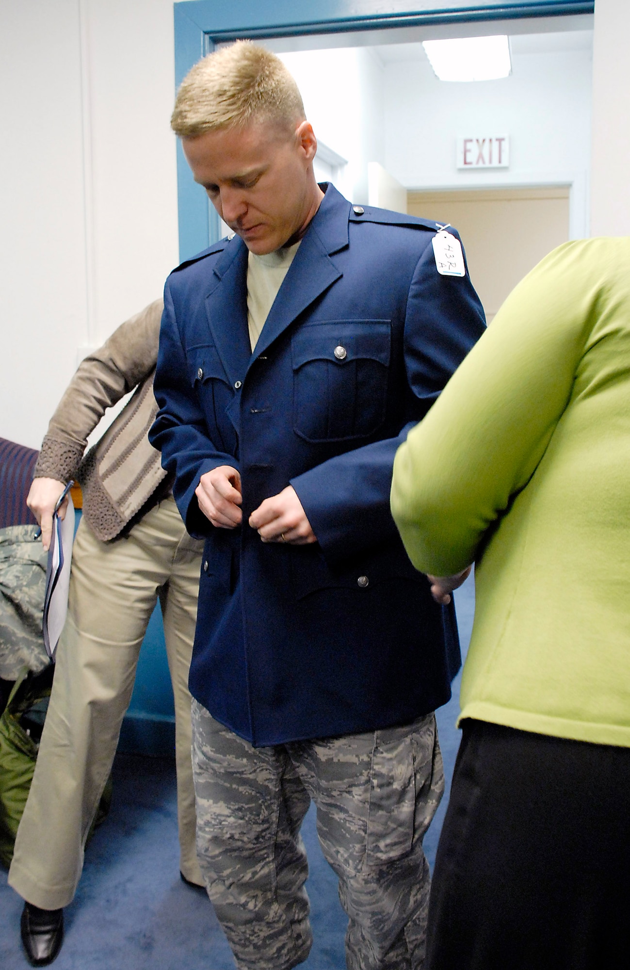 Lt. Col. Jeff Yocum tries on a heritage coat during a fit/wear test April 8 at the Pentagon. Measurements from various Airmen were collected by members of the Air Force Uniform Program Office so any fit adjustments can be made before the heritage service coats get field tested throughout the Air Force. Colonel Yocum is the Air Force chief of staff manpower and personnel executive officer. (U.S. Air Force photo/Staff Sgt. Julie Weckerlein) 
