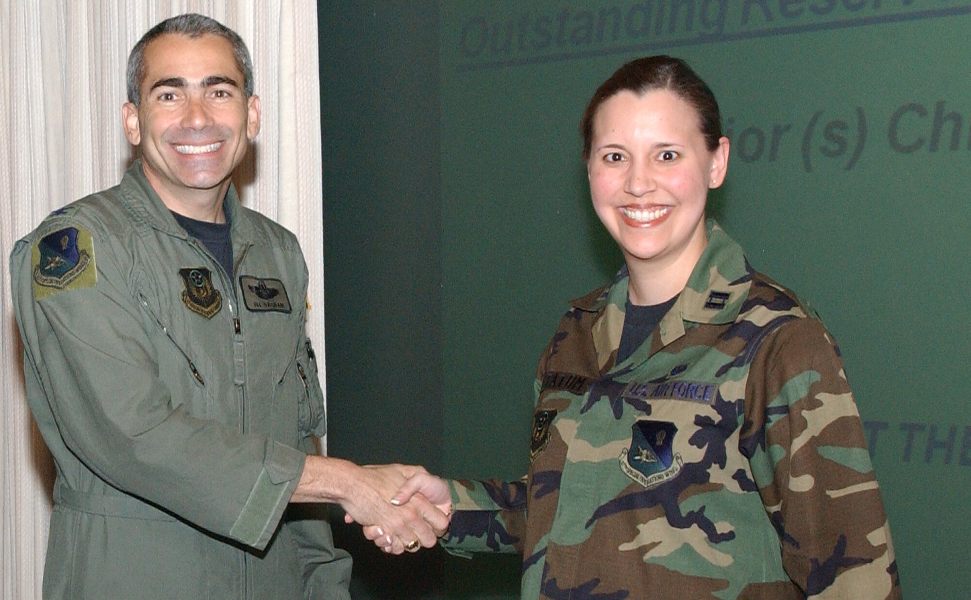 CANNON AIR FORCE BASE, N.M.-- Maj. Christina Tatum, 27th Special Operations Wing Legal Office, receives the Outstanding Reserve Judge Advocate award presented to her by Col. Valentino Bagnani III, 27th Special Operations Wing vice commander. Major Tatum received the award at the wing staff meeting on April 8. (U.S. Air Force photo by Airman Maynelinne De La Cruz)                               