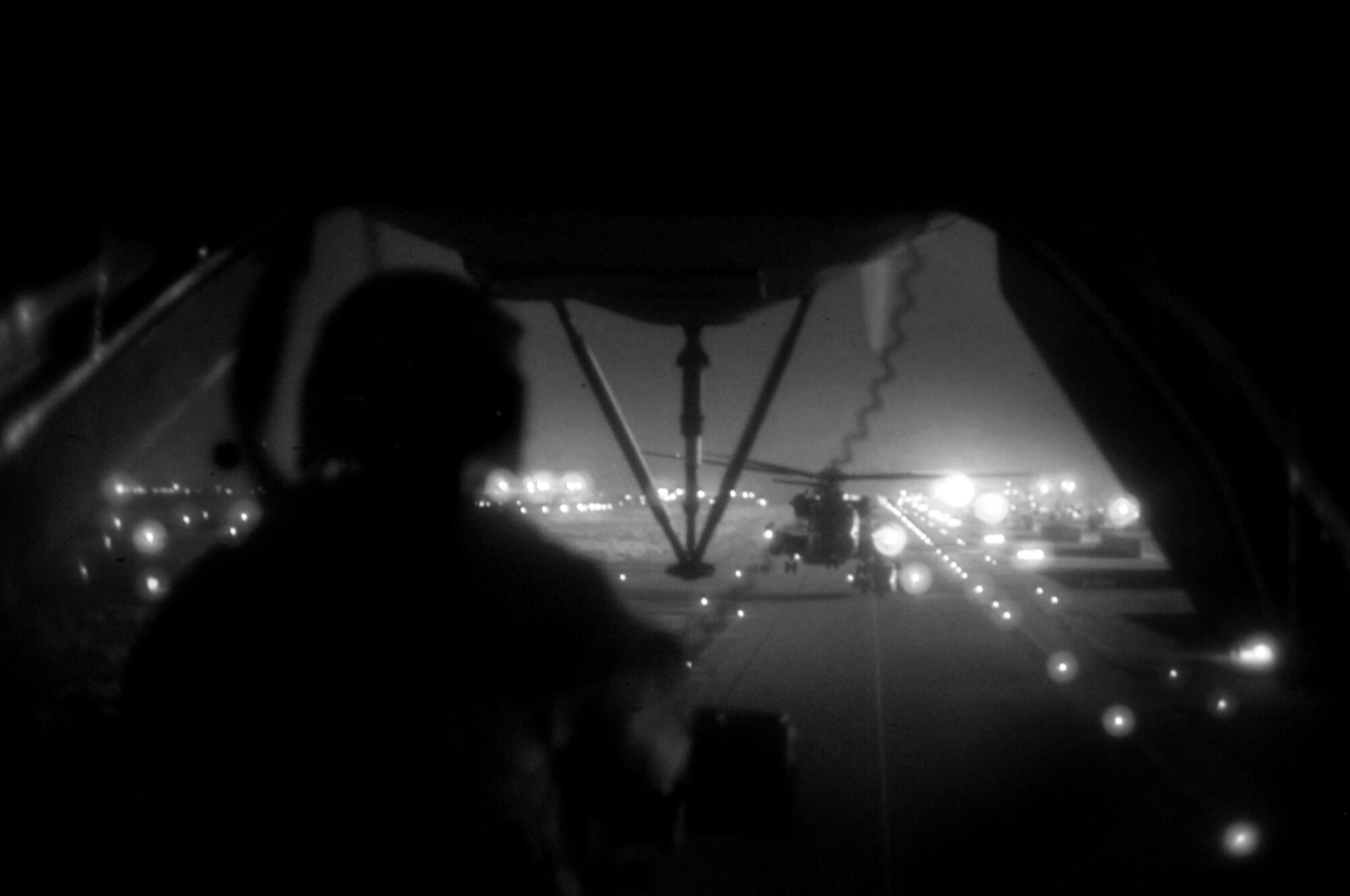 Airmen of the Combined Joint Special Operations Air Command fly in MH-53 Pave Low tail number 68-10357 in March at an undisclosed location in Iraq. The mission for the helicopter crew was to obtain certain persons of interest involved in criminal activity, including terrorism, in Iraq. The MH-53 was retired after 38 years of service, including combat operations in Vietnam. (U.S. Navy photo/Petty Officer 2nd Class Michael Blackwell II) 
