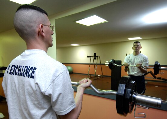 SCOTT AIR FORCE BASE, Ill. – Maj. Chris Juarez, 375th Contracting Squadron commander, exercises at the James Gym. Major Juarez is one of the first people to score an excellent 200 on the extended PT scale. (U.S. Air Force photo/Senior Airman Mildred Guevara)