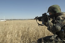 MINOT AIR FORCE BASE, N.D. -- Senior Airman Corin Dolson, 91st Missile Security Forces Squadron, takes part in a tactical firing exercise here  April 7, to prepare for the upcoming Guardian Challenge exercise in May.  (U.S. Air Force photo by Airman 1st Class Jesse Lopez)