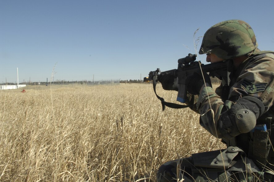 MINOT AIR FORCE BASE, N.D. -- Senior Airman Corin Dolson, 91st Missile Security Forces Squadron, takes part in a tactical firing exercise here  April 7, to prepare for the upcoming Guardian Challenge exercise in May.  (U.S. Air Force photo by Airman 1st Class Jesse Lopez)
