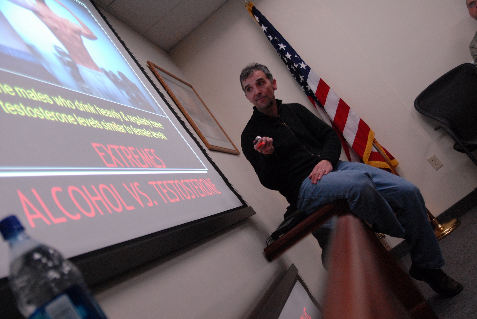 John Underwood, president and founder of the American Athletics Institute, presents the negative physiological and residual effects of heavy alcohol use on athletes and Airmen whose motto is “Fit to Fight” April 1. (U.S. Air Force photo/John Turner) 