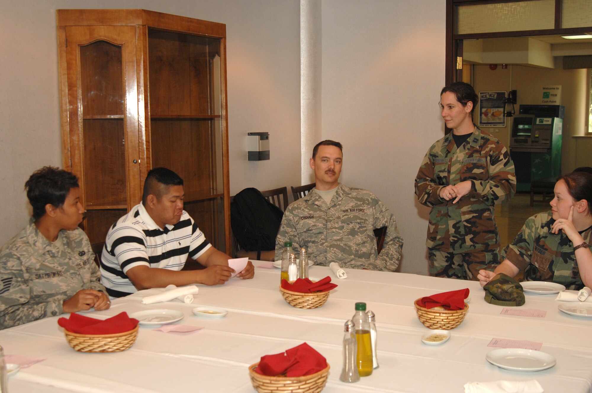 Capt. Cheri Guikema (right), 39th Air Base Wing Sexual Assault Response Coordinator, speaks with Sexual Assault Prevention and Response program victim advocates during a training luncheon April 9. There are 18 victim advocate volunteers on base trained to help victims of sexual assault. (U.S. Air Force photo by Senior Airman Heather Stanton)