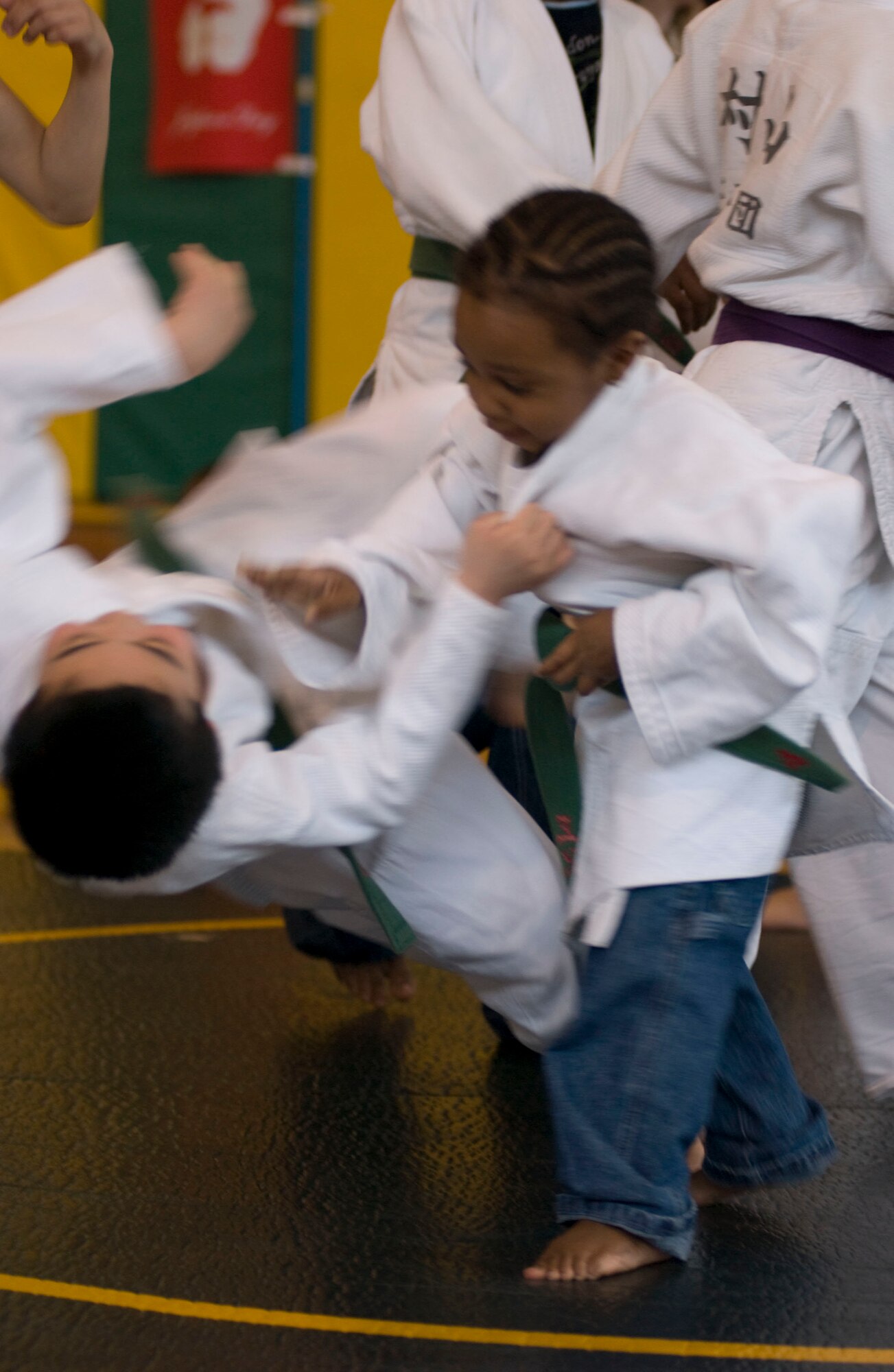 MISAWA AIR BASE, Japan – Azaleen Jenkins throws a judo student in the Edgren High School Gymnasium on April 5, 2008. Azaleen was one of the children given the opportunity to try judo during their demonstration as part of “Japan Day” at Misawa Air Base. (U.S. Air Force photo by Senior Airman Samuel Morse)